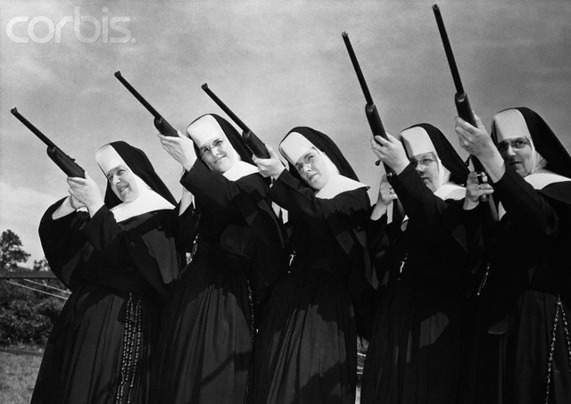 Row of Nuns Aiming Rifles