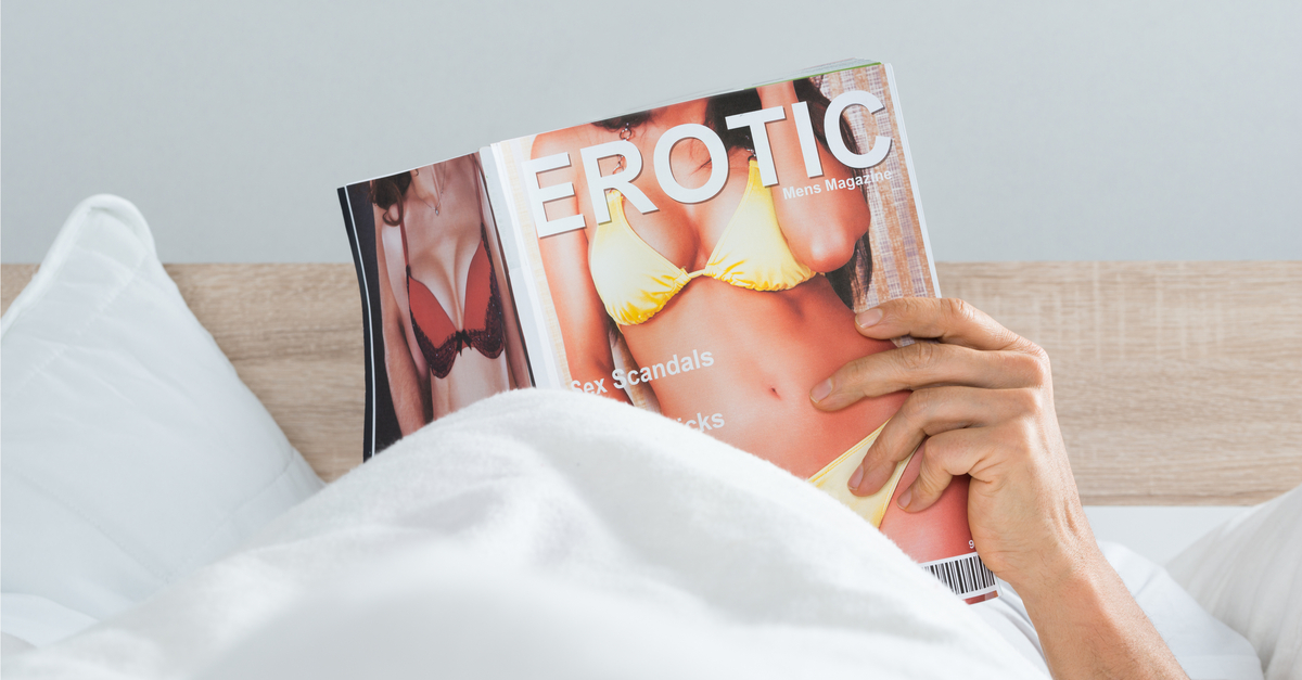 Man reading erotic magazine
