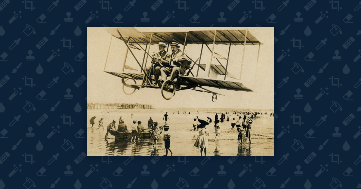 Hoax postcard image of an early airplane flying dangerously low over a California beach