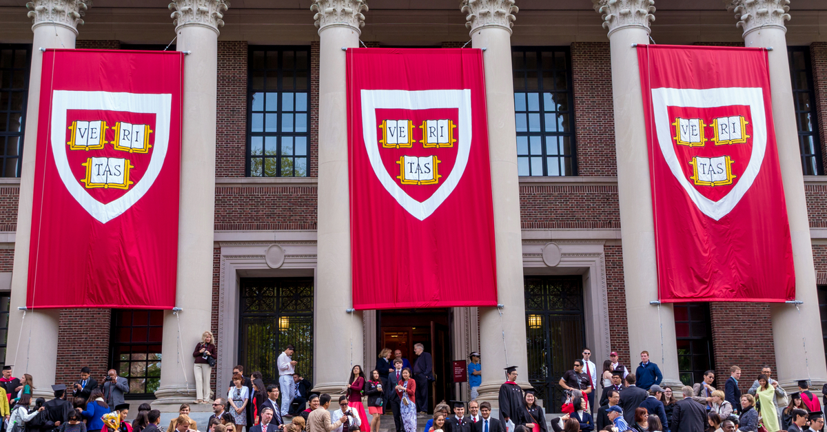 Harvard banner with students underneath