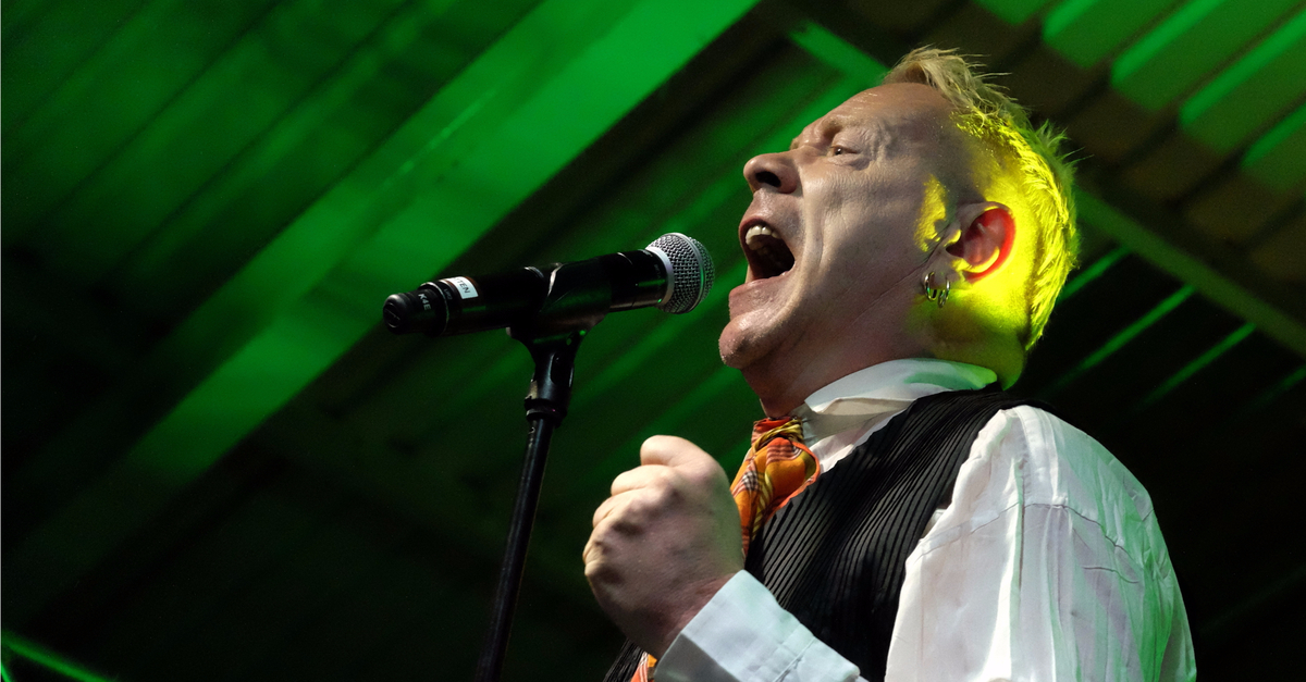 John Lydon, a.k.a. Johnny Rotten of the Sex Pistols and Public Image Ltd, singing into a microphone