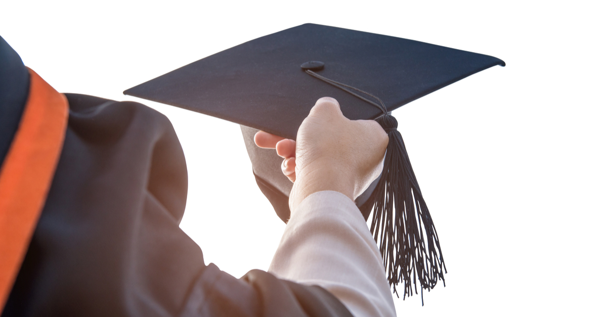 Image of university graduate holding cap