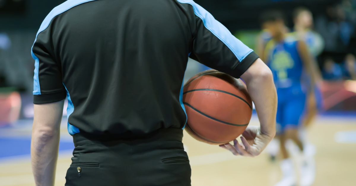Referee holding a basketball