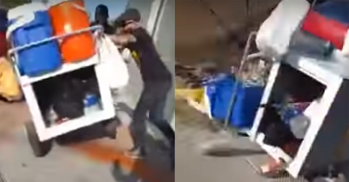 Still from footage of Carlos Hakas kicking over an elotero's cart