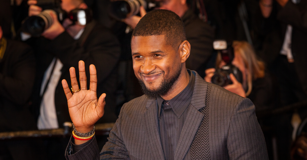 Usher waving