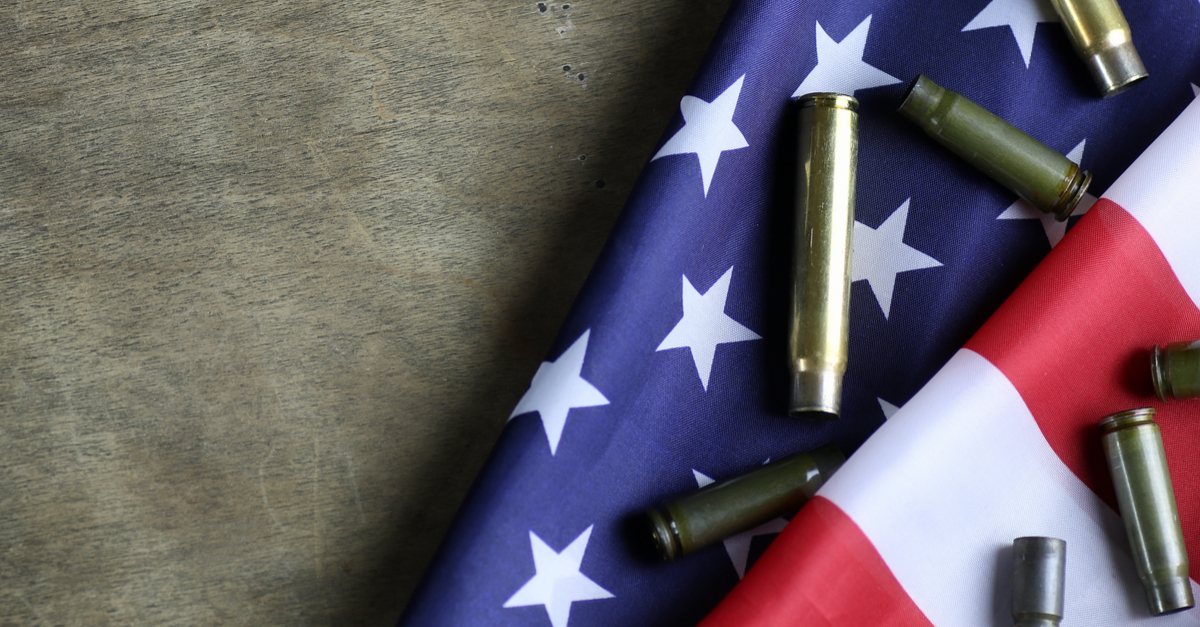 Bullet shells on American flag, gun control concept