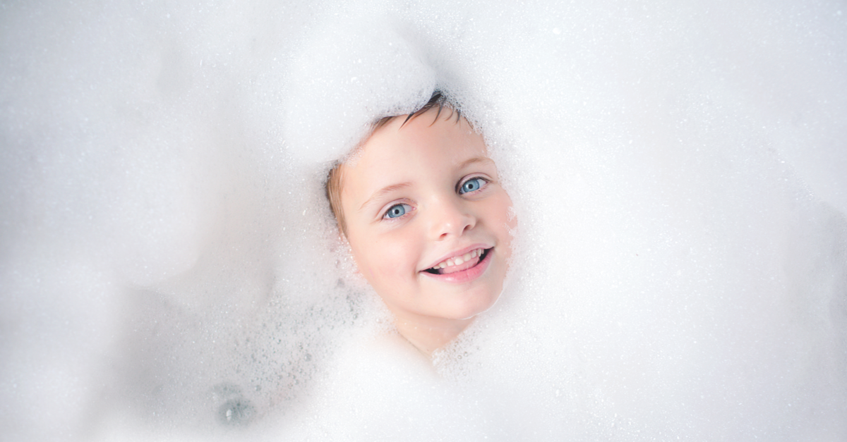 Little kid in a bubble bath
