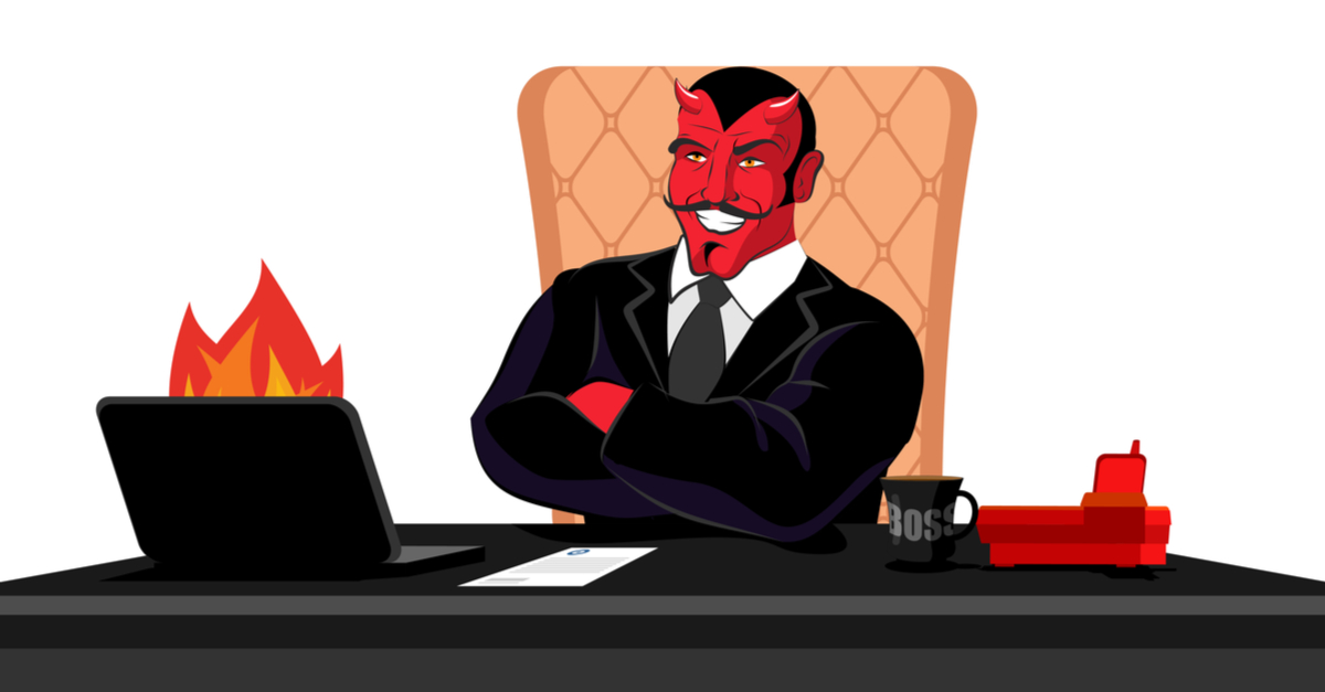 Artistic representation of Satan in a suit sitting at a desk in front of a burning laptop.