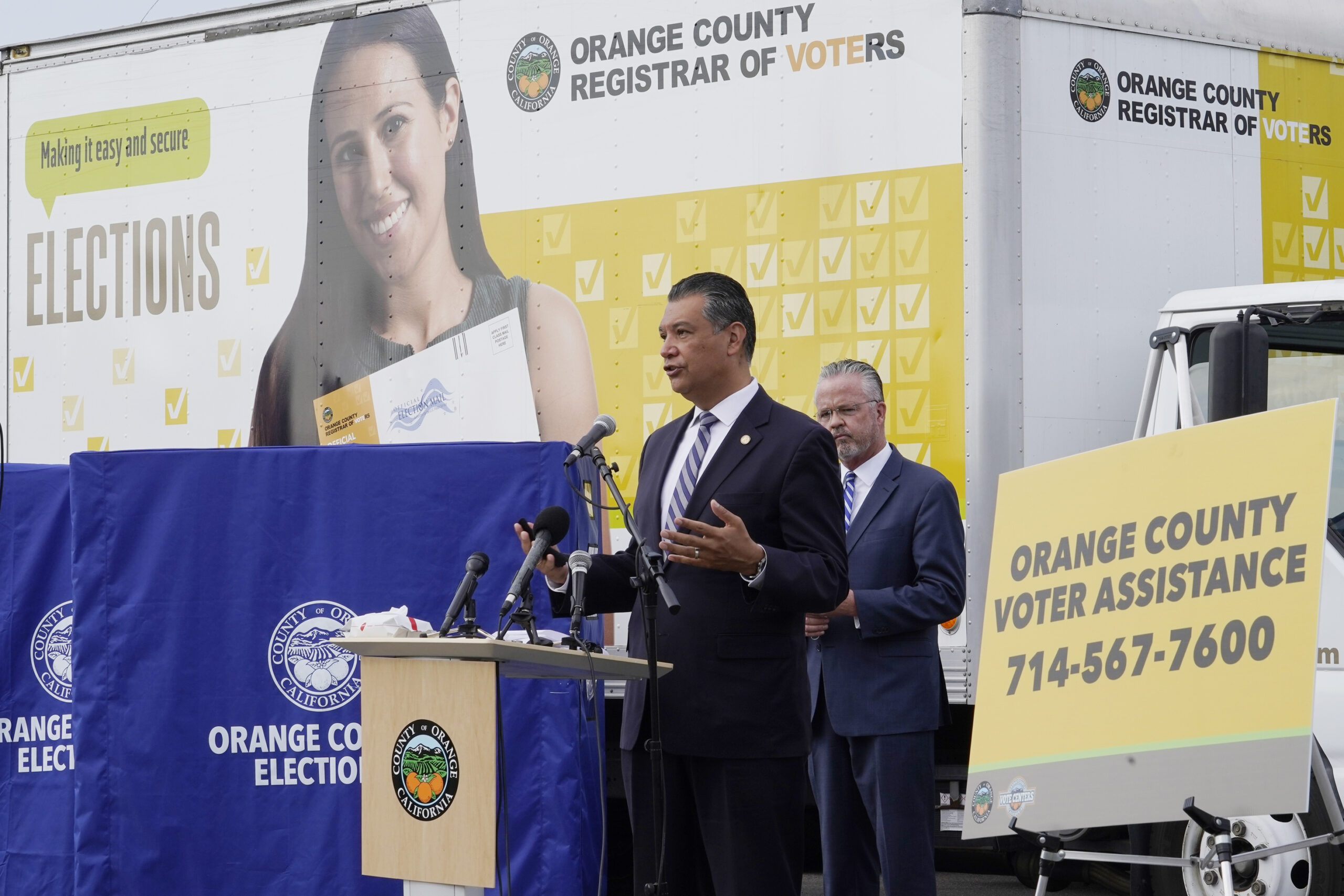 FILE - In this Oct. 5, 2020, file photo, California Secretary of State Alex Padilla, left, and Orange County Registrar of Voters Neal Kelley hold a news conference on Orange County's comprehensive plans to safeguard the election and provide transparency in Santa Ana, Calif. California election officials have received reports that unofficial ballot drop boxes were placed in several counties and said these set-ups are illegal. The Orange County Register reports Monday, Oct. 12, 2020, that Secretary of State spokesman Sam Mahood said boxes were reported in Fresno, Los Angeles and Orange counties at locations including political party offices, candidate headquarters and churches. He said the state was looking into the origin of the boxes. (AP Photo/Damian Dovarganes, File)