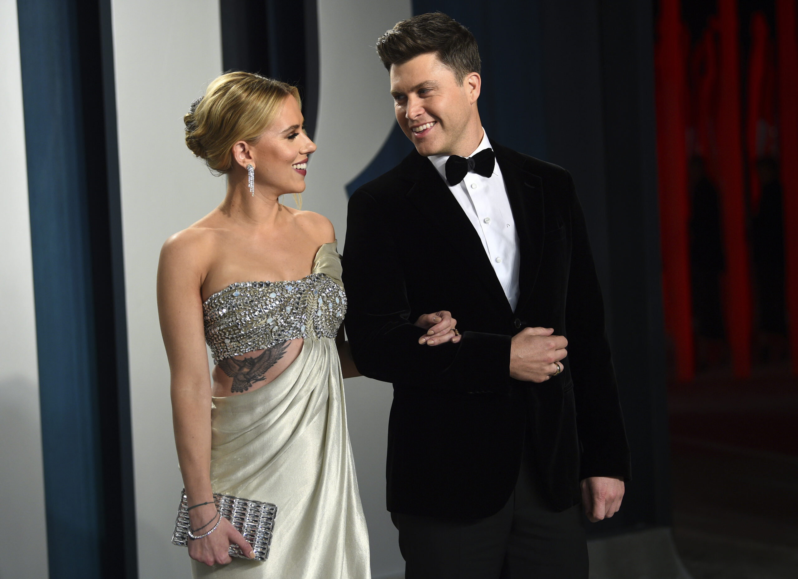 FILE - In this Feb. 9, 2020 file photo, Scarlett Johansson, left, and Colin Jost arrive at the Vanity Fair Oscar Party in Beverly Hills, Calif. Meals on Wheels America announced Thursday on Instagram that Johansson and Jost married over the weekend in an intimate ceremony. (Photo by Evan Agostini/Invision/AP, FIle)