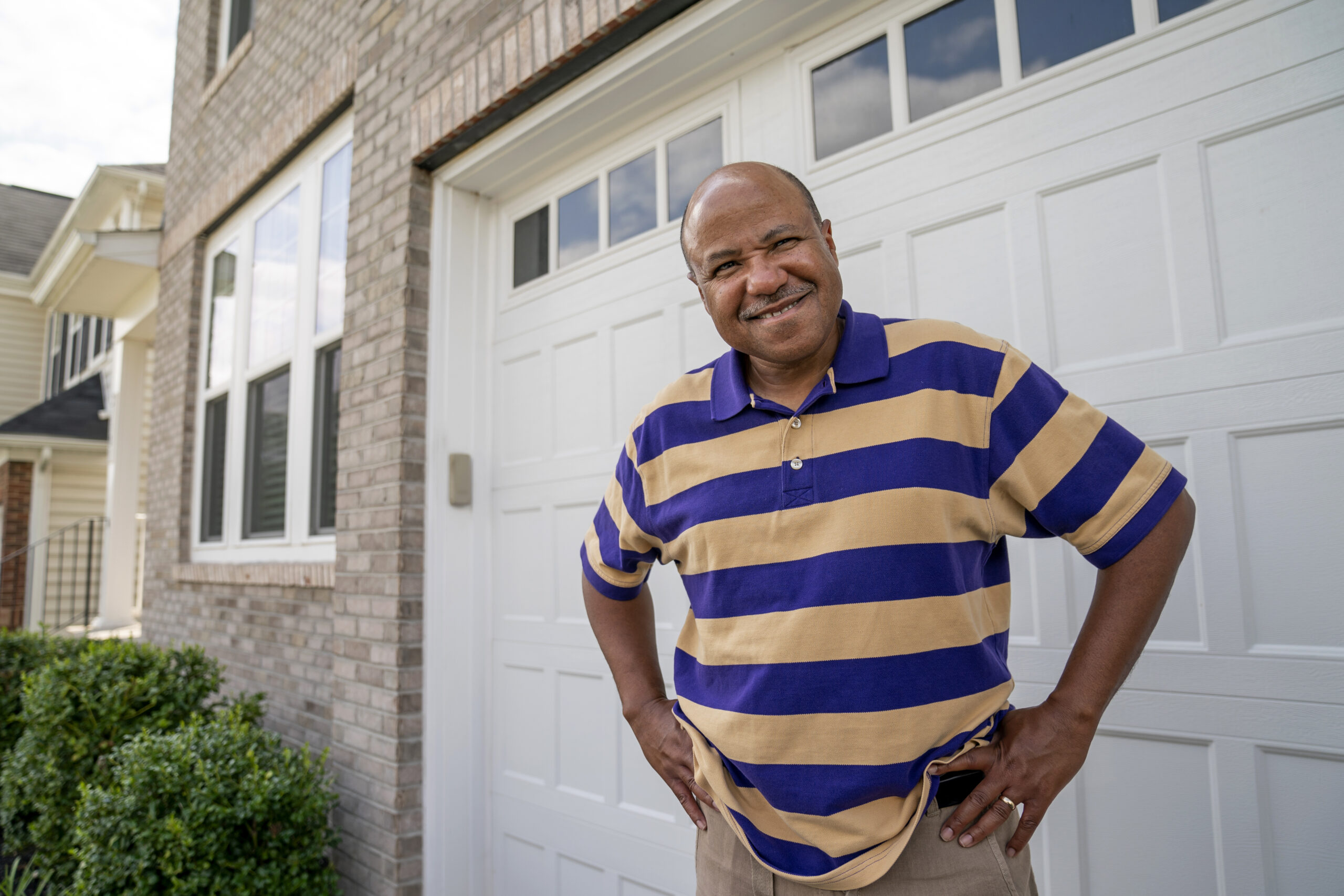 Banking executive Bob Marshall, an active stock investor, poses for a photo at his home in Ashburn, Va., Friday, Aug. 7, 2020. Nearly half of all U.S. households don’t own any stocks, and a disproportionate number of them are from Black and other racial-minority households. Differences in financial-literacy education may be one factor, Marshall said. Or, because fewer Black families have wealth that has carried through generations, they may be more wary of risky investments. (AP Photo/J. Scott Applewhite)
