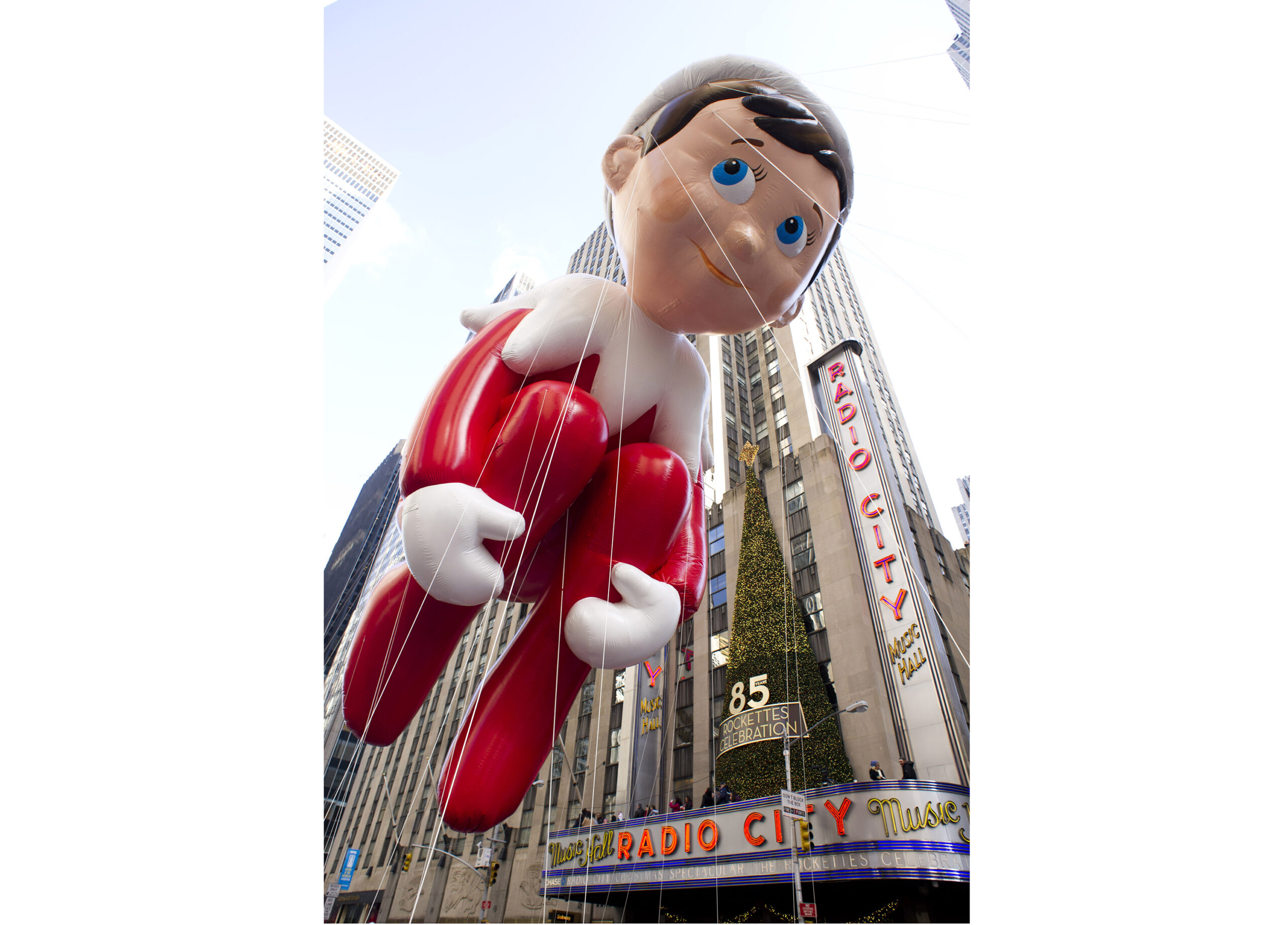 FILE - The Elf on the Shelf balloon floats in the Macy's Thanksgiving Day Parade in New York in New York on Nov. 22, 2012. The pandemic may have upended most traditions this holiday season but the annual New York City parade will still march on with balloons, dancers, floats, Broadway shows and Santa — albeit this time heavily tweaked for safety. (AP Photo/Charles Sykes, File)
