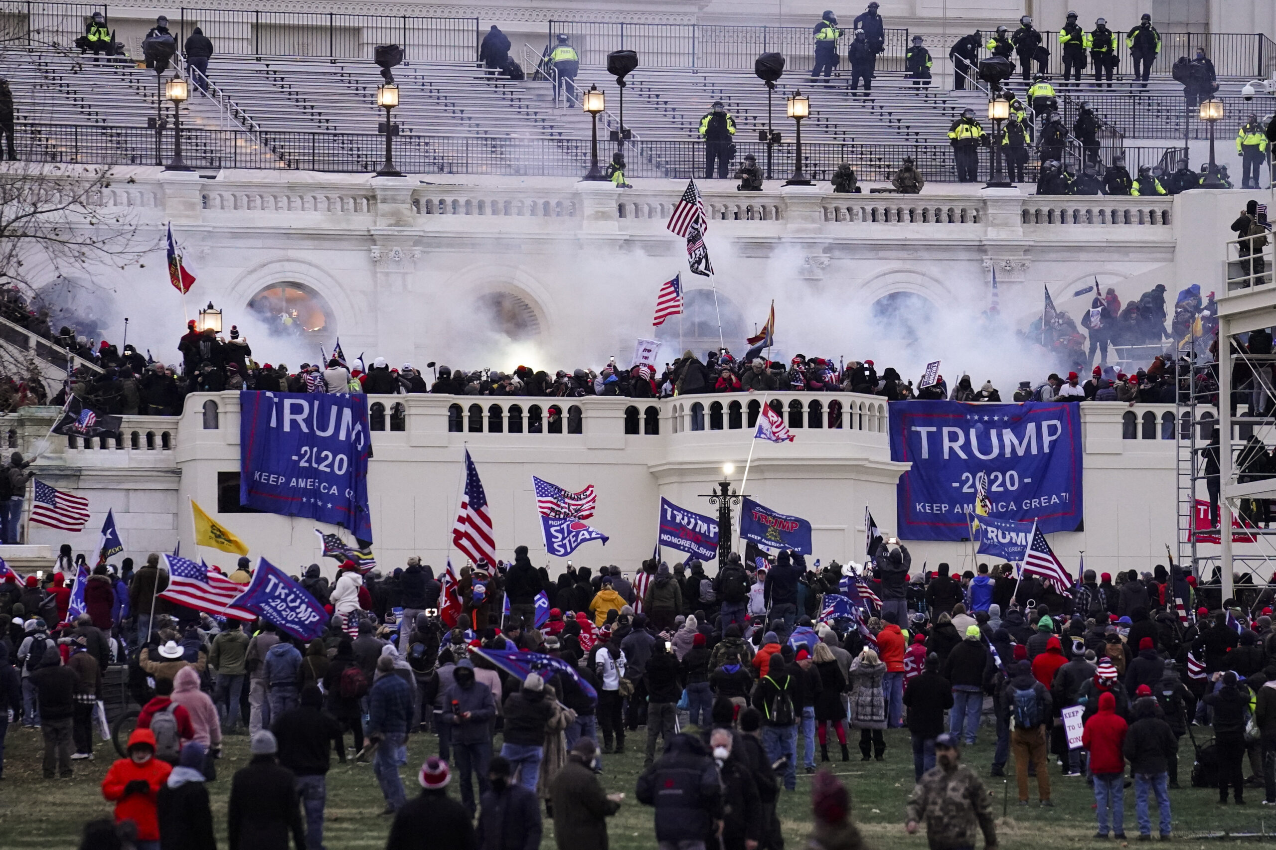 Violent protesters, loyal to President Donald Trump, storm the Capitol, Wednesday, Jan. 6, 2021, in Washington. It's been a stunning day as a number of lawmakers and then the mob of protesters tried to overturn America's presidential election, undercut the nation's democracy and keep Democrat Joe Biden from replacing Trump in the White House. (AP Photo/John Minchillo)