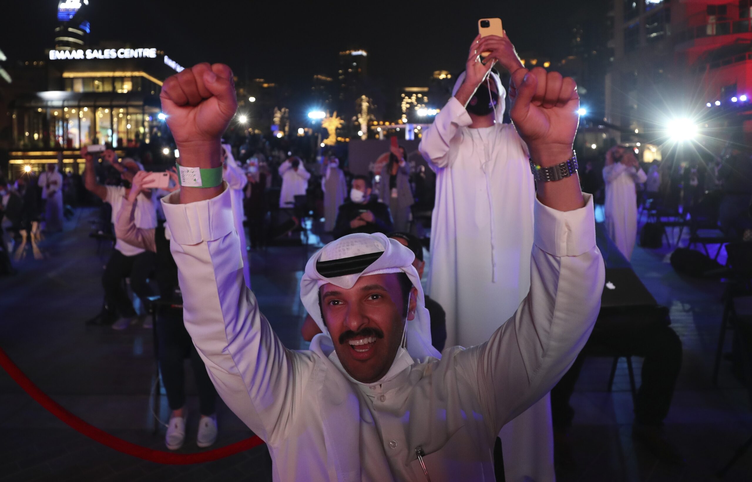 Emiratis celebrate after the Hope Probe enters Mars orbit as a part of Emirates Mars mission, in Dubai, United Arab Emirates, Tuesday, Feb. 9, 2021. The spacecraft from the United Arab Emirates swung into orbit around Mars in a triumph for the Arab world’s first interplanetary mission. It is the first of three robotic explorers arriving at the red planet over the next week and a half. (AP Photo/Kamran Jebreili)