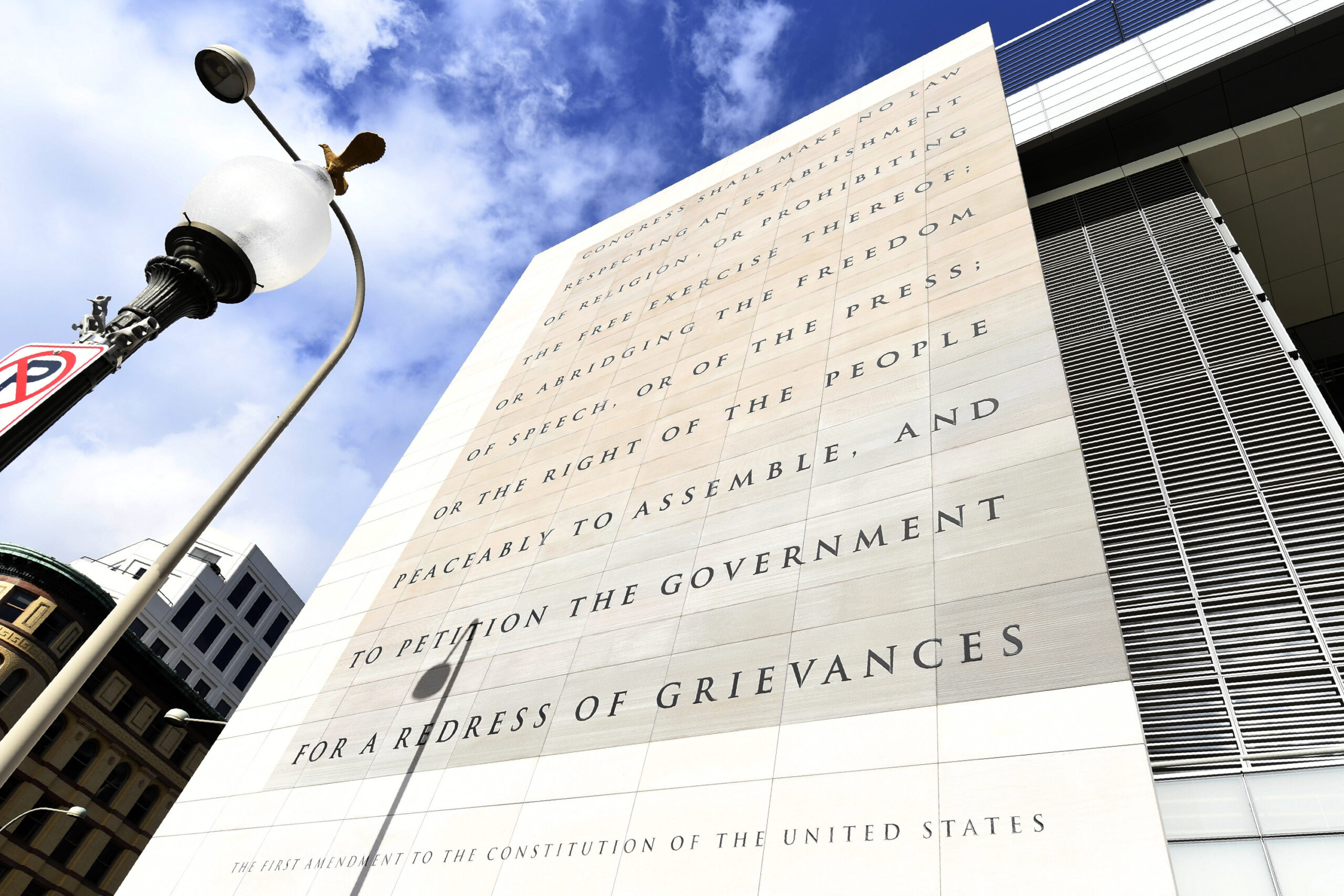 FILE—This file photo from Dec. 31, 2019 shows the facade bearing the First Amendment of the U.S. Constitution on the front of the Newseum, a private museum dedicated to exploring modern history as told through the eyes of journalists, on the last day it was open in Washington. The façade will be reinstalled at The National Constitution Center in Philadelphia. (AP Photo/Susan Walsh, File)