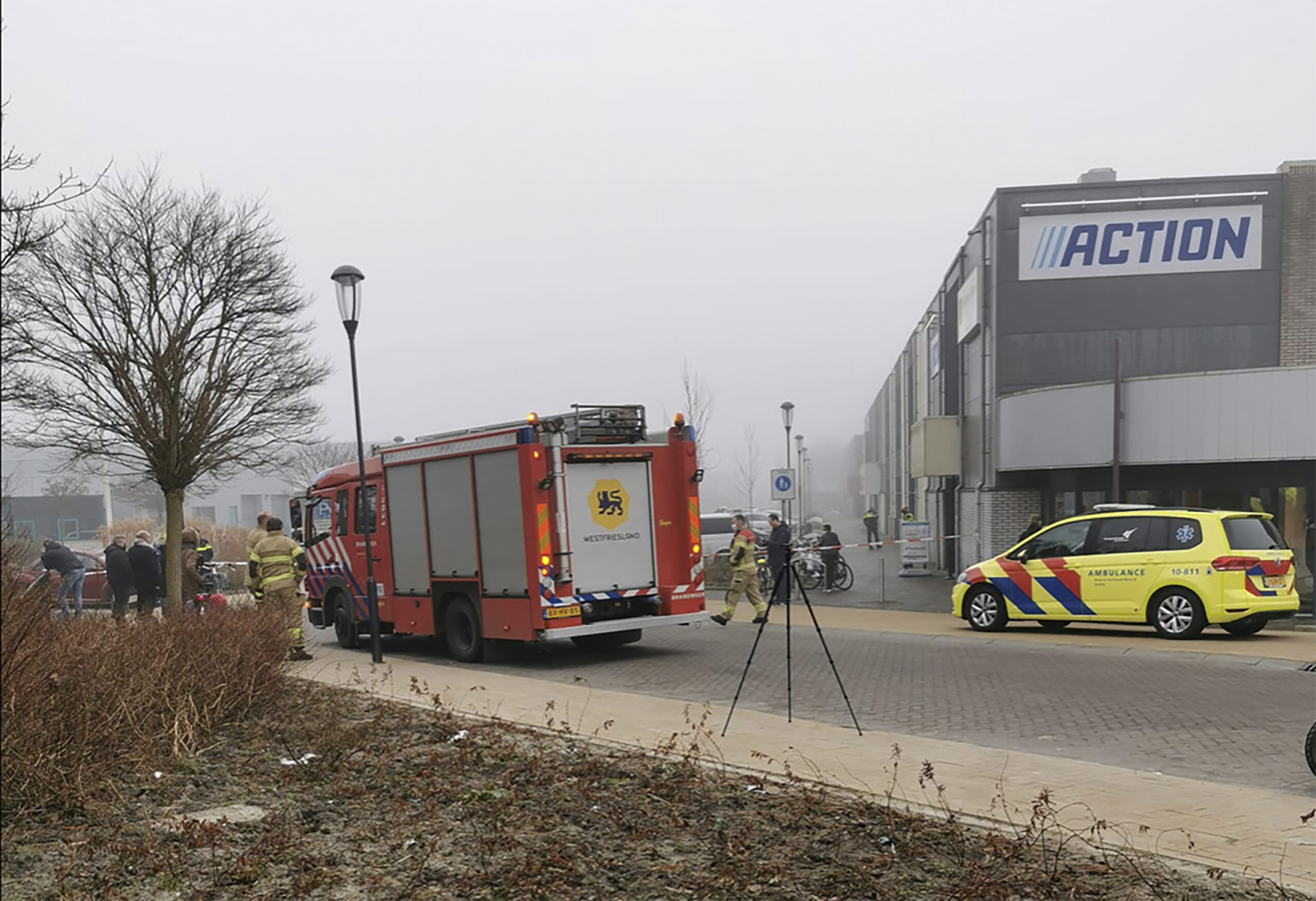 Emergency services attend the scene close to a coronavirus test station after a homemade firework was detonated in Bovenkarspel, Netherlands, Wednesday March 3, 2021. The homemade firework, a so-called "pipe" firework, was fired near to the Covid test station Wednesday and broke some windows but no people are reported injured. (Stefanie ter Koele / AP)
