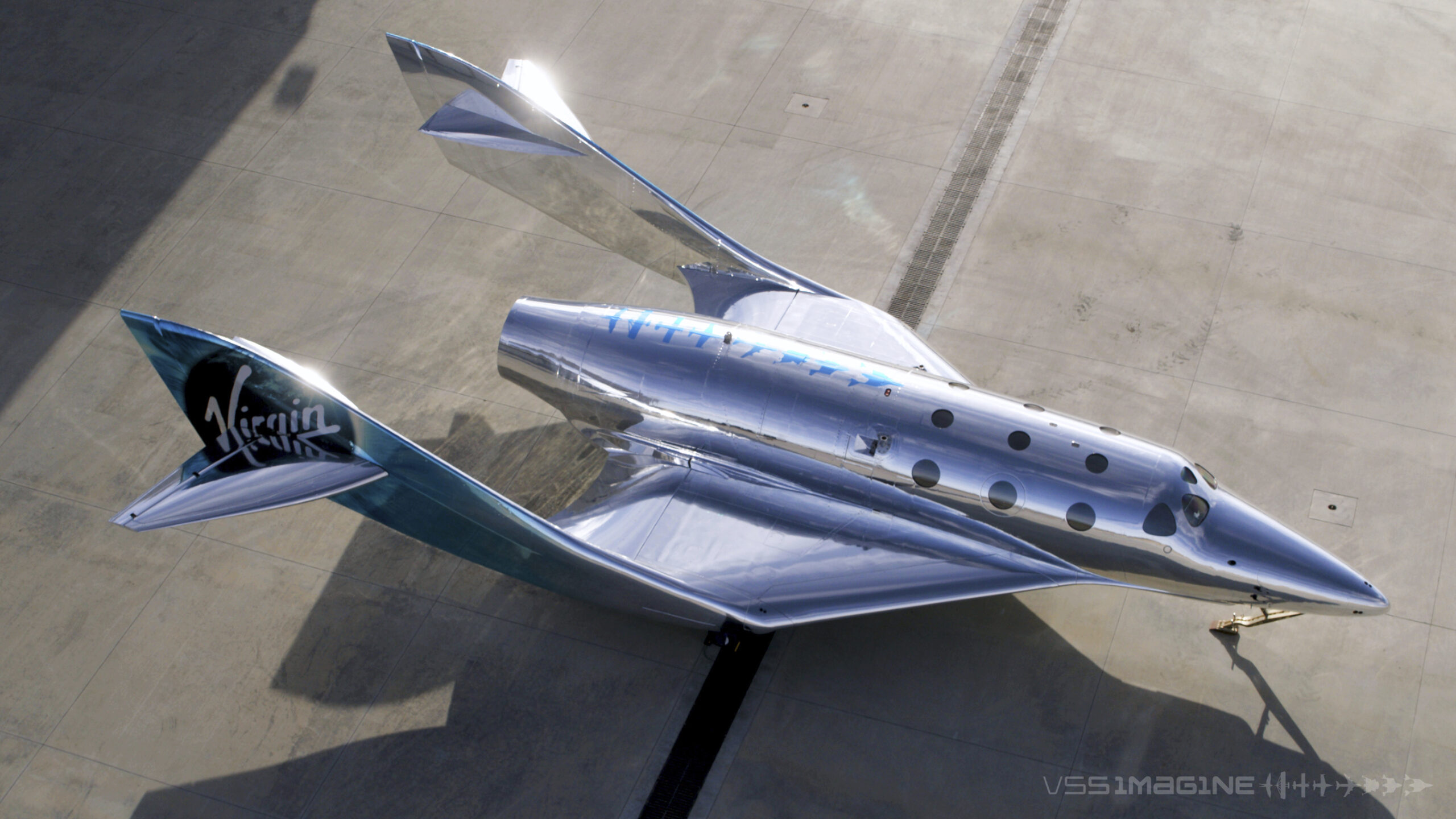 In this undated photo provided by Virgin Galactic is the VSS Imagine, the first SpaceShip III in the Virgin Galactic Fleet in Mojave, Calif. Virgin Galactic rolled out its newest spaceship Tuesday, March 30, 2021, as the company looks to resume test flights in the coming months at its headquarters in the New Mexico desert. Company officials said it will likely be summer before the ship undergoes glide flight testing at Spaceport America in southern New Mexico. (Virgin Galactic via AP).