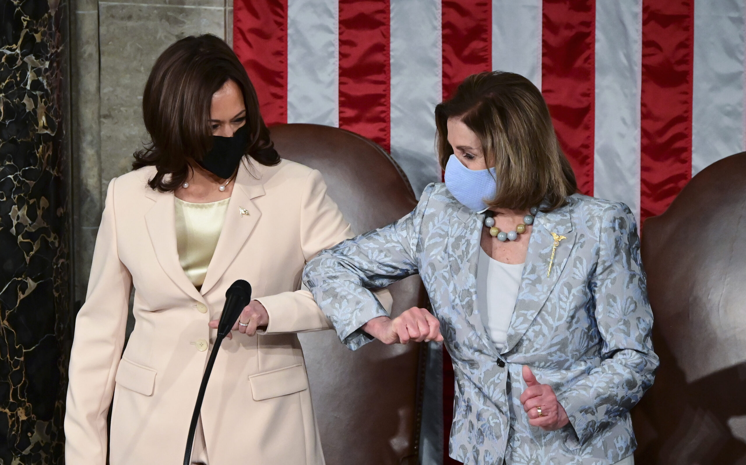 Vice President Kamala Harris, left, greets House Speaker Nancy Pelosi of Calif., ahead of President Joe Biden addressing a joint session of Congress, Wednesday, April 28, 2021, in the House Chamber at the U.S. Capitol in Washington. (Jim Watson/Pool via AP)