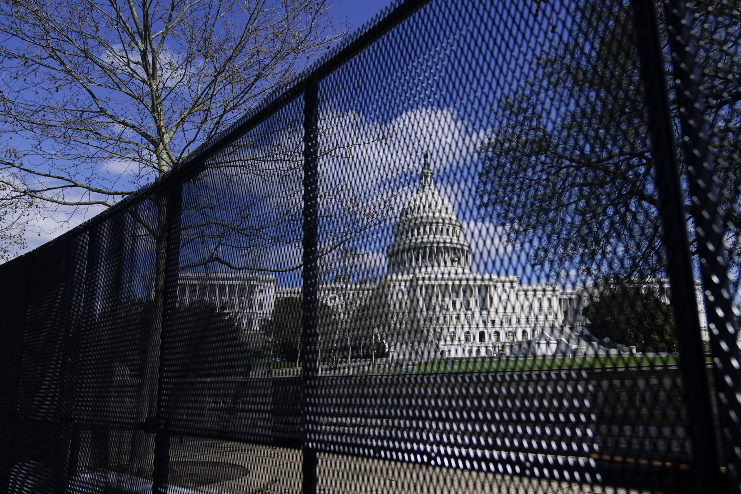 The U.S. Capitol is seen behind security fencing after a car that crashed into a barrier on Capitol Hill in Washington, Friday, April 2, 2021. (AP Photo/Carolyn Kaster)