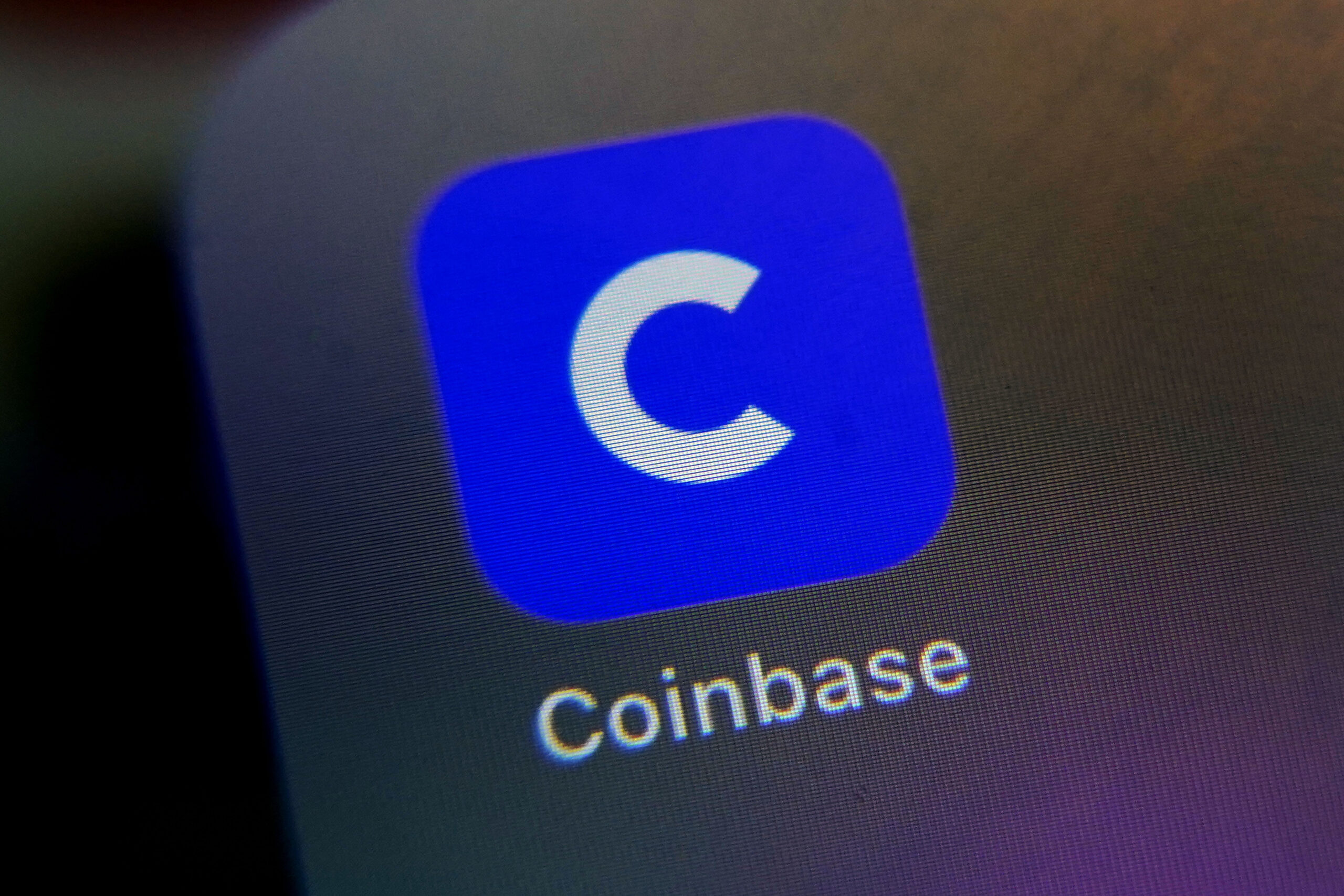 The mobile phone icon for the Coinbase app is shown in this photo, in New York, Tuesday, April 13, 2021. Coinbase is going public at a time when chatter about cryptocurrencies is everywhere, even at the United States Federal Reserve. (AP Photo/Richard Drew)