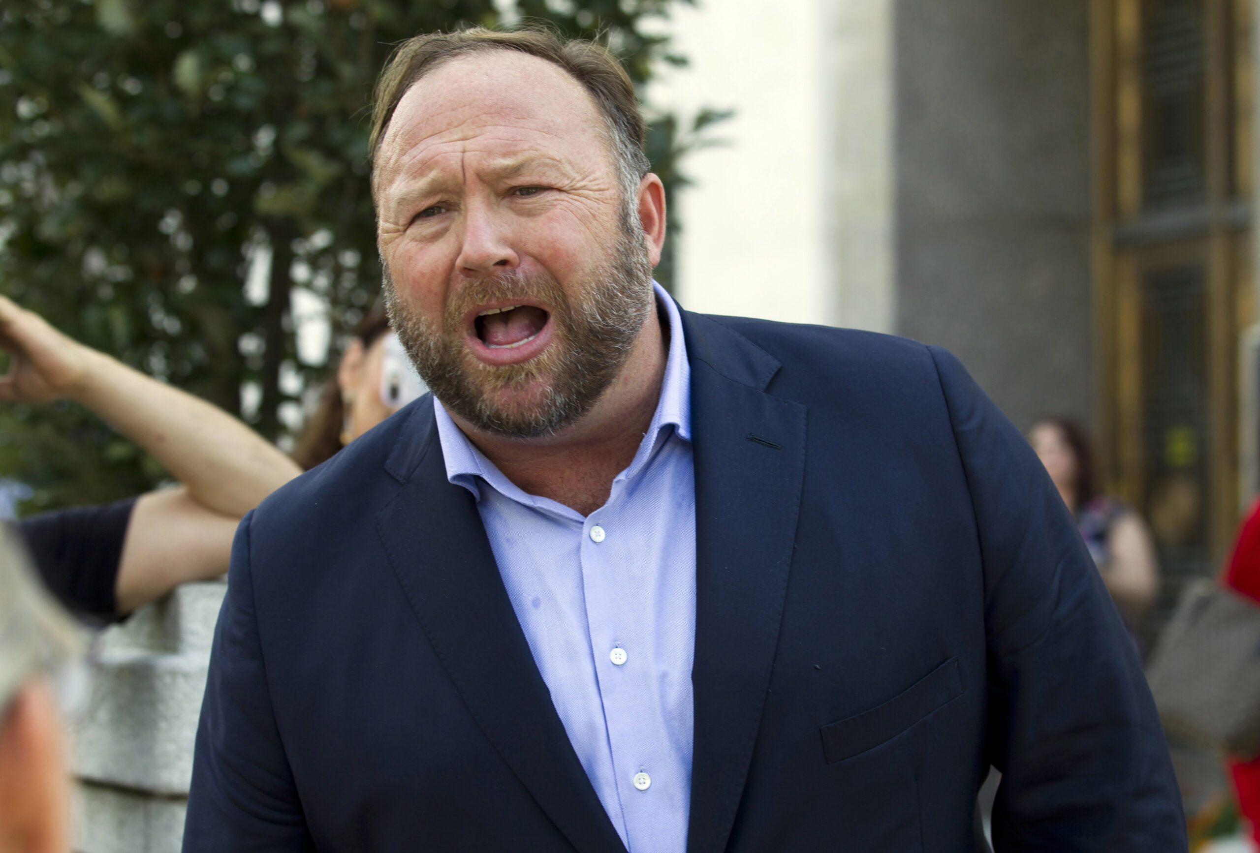 FILE- In this Sept. 5, 2018, file photo Alex Jones speaks outside of the Dirksen building of Capitol Hill in Washington. The U.S. Supreme Court on Monday, April 5, 2021, declined to hear an appeal by the Infowars host and conspiracy theorist, who was fighting a Connecticut court sanction in a defamation lawsuit brought by relatives of some of the victims of the Sandy Hook Elementary School shooting. (AP Photo/Jose Luis Magana, File)