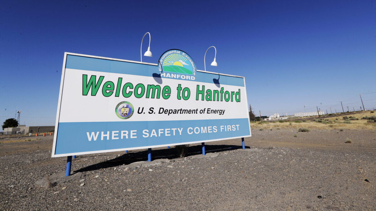 FILE - In this Aug. 13, 2019, file photo, a sign at the Hanford Nuclear Reservation is posted near Richland, Wash. Officials say an underground nuclear waste storage tank that dates to World War II appears to be leaking contaminated liquid into the ground. The U.S. Department of Energy said Thursday, April 29, 2021, that Tank B-109 holds 123,000 gallons of radioactive waste left from the production of plutonium for nuclear weapons on the Hanford Nuclear Reservation. (AP Photo/Elaine Thompson, File)