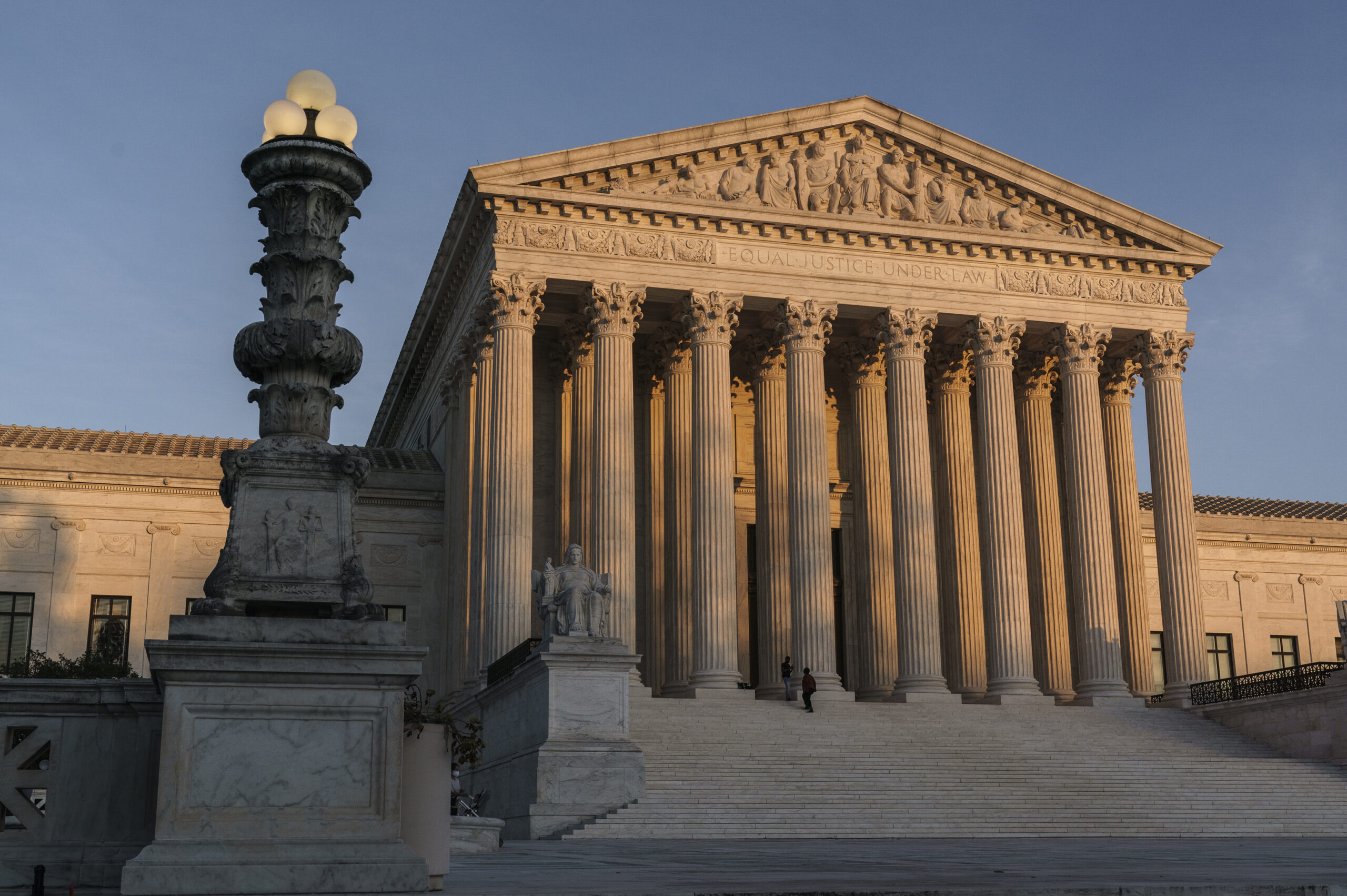 FILE - In this Nov. 6, 2020, file photo the Supreme Court is seen as sundown in Washington. The Supreme Court says it will not hear a case out of Pennsylvania related to the 2020 election, a case that had lingered while similar election challenges had already been rejected by the justices. The high court directed a lower court to dismiss the case as moot. (AP Photo/J. Scott Applewhite, File)