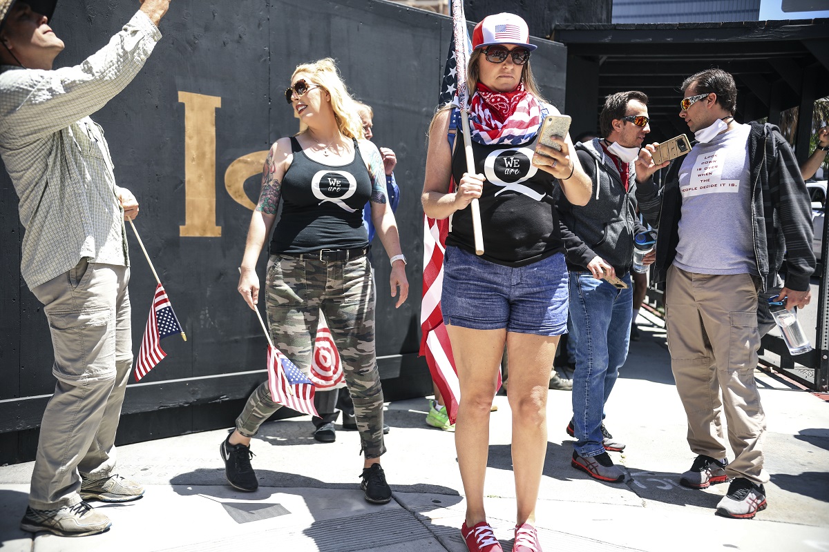 Conspiracy theorist QAnon demonstrators protest during a rally