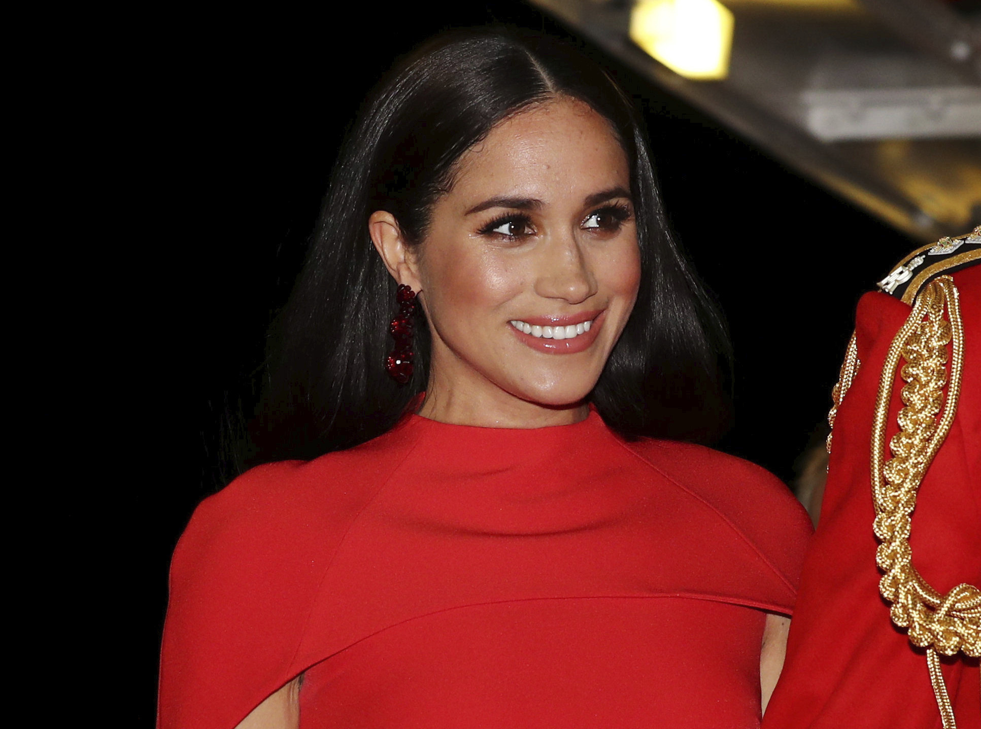 FILE - In this Saturday March 7, 2020 file photo, Meghan, Duchess of Sussex with Prince Harry arrives at the Royal Albert Hall in London, to attend the Mountbatten Festival of Music. Meghan, the Duchess of Sussex, on Wednesday May 5, 2021, won her remaining copyright claim against a British tabloid publisher over the publication of a personal letter she wrote to her estranged father. (Simon Dawson/Pool via AP, File)