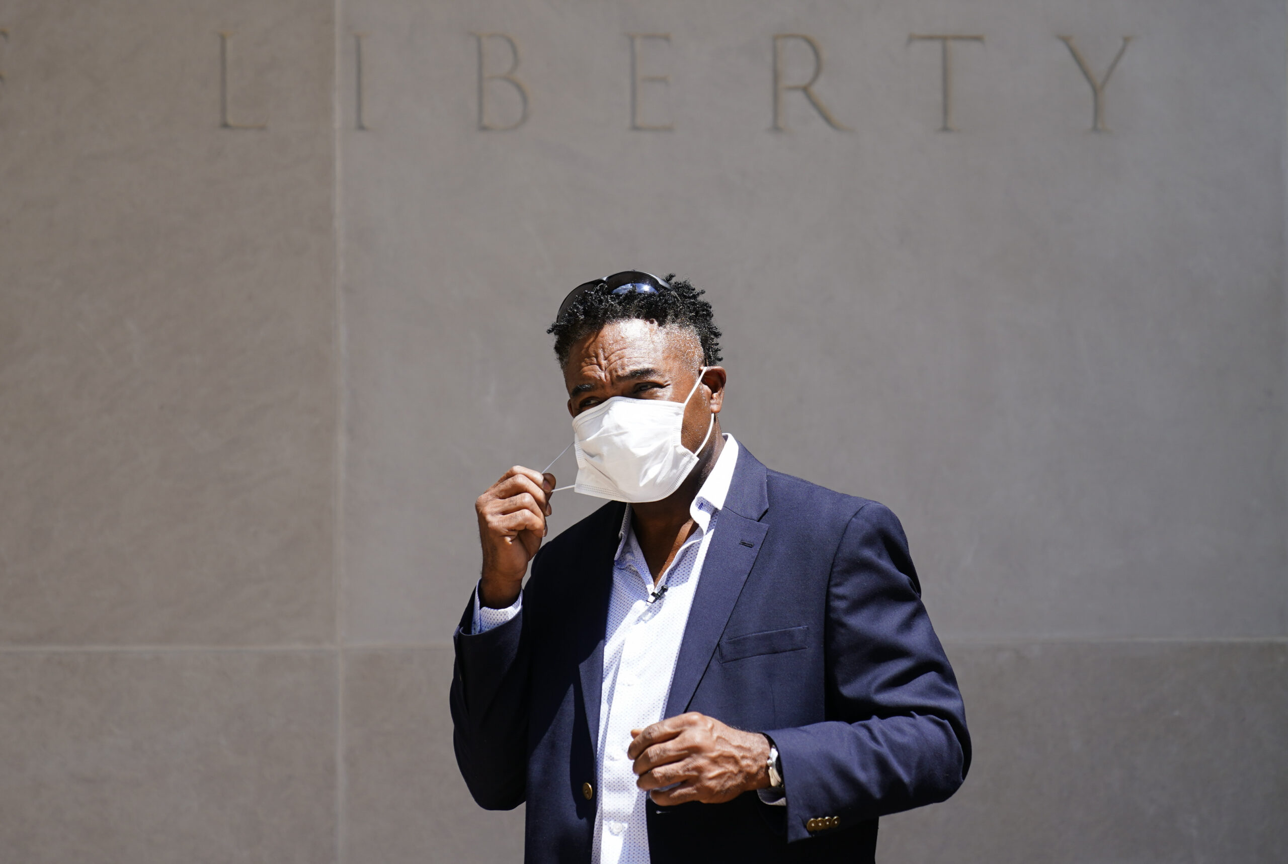Former NFL player Ken Jenkins exits the building after delivering tens of thousands of petitions demanding equal treatment for everyone involved in the settlement of concussion claims against the NFL, to the federal courthouse in Philadelphia, Friday, May 14, 2021. (AP Photo/Matt Rourke)