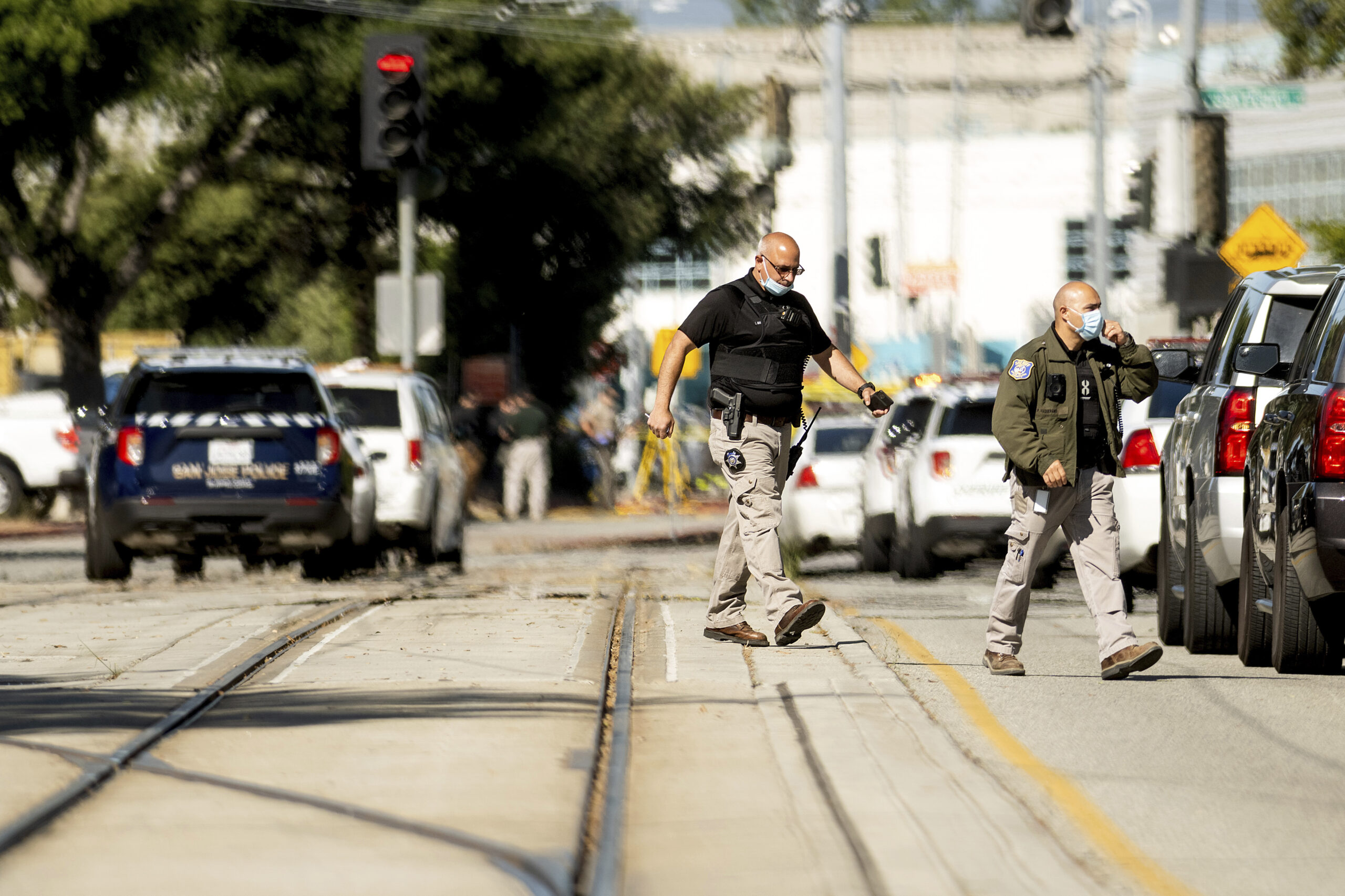 Law enforcement officers respond to the scene of a shooting at a Santa Clara Valley Transportation Authority (VTA) facility on Wednesday, May 26, 2021, in San Jose, Calif. Santa Clara County sheriff's spokesman said the railyard shooting left multiple people, including the shooter, dead. (AP Photo/Noah Berger)