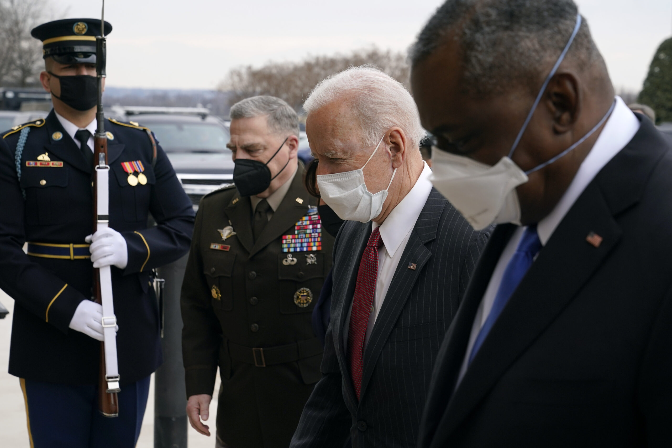 FILE - In this Feb. 10, 2021, file photo, President Joe Biden walks with Joint Chiefs Chairman Gen. Mark Milley, second from left, and Defense Secretary Lloyd Austin as he arrives at the Pentagon in Washington. Milley says he is now open to considering a proposal to take decisions on sexual assault prosecution out of the hands of military commanders. This is a potentially significant shift in the debate over combating sexual assault in the military.(AP Photo/Patrick Semansky, File)