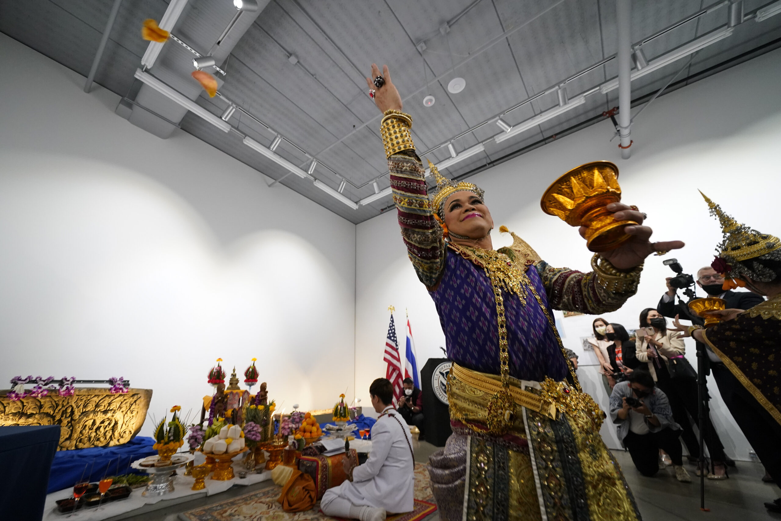 Thai dancers perform during a ceremony to return two stolen hand-carved sandstone lintels dating back to the 9th and 10th centuries to the Thai government Tuesday, May 25, 2021, in Los Angeles. The 1,500-pound (680-kilogram) antiquities had been stolen and exported from Thailand — a violation of Thai law — a half-century ago, authorities said, and donated to the city of San Francisco. They had been exhibited at the San Francisco Asian Art Museum. (AP Photo/Ashley Landis)