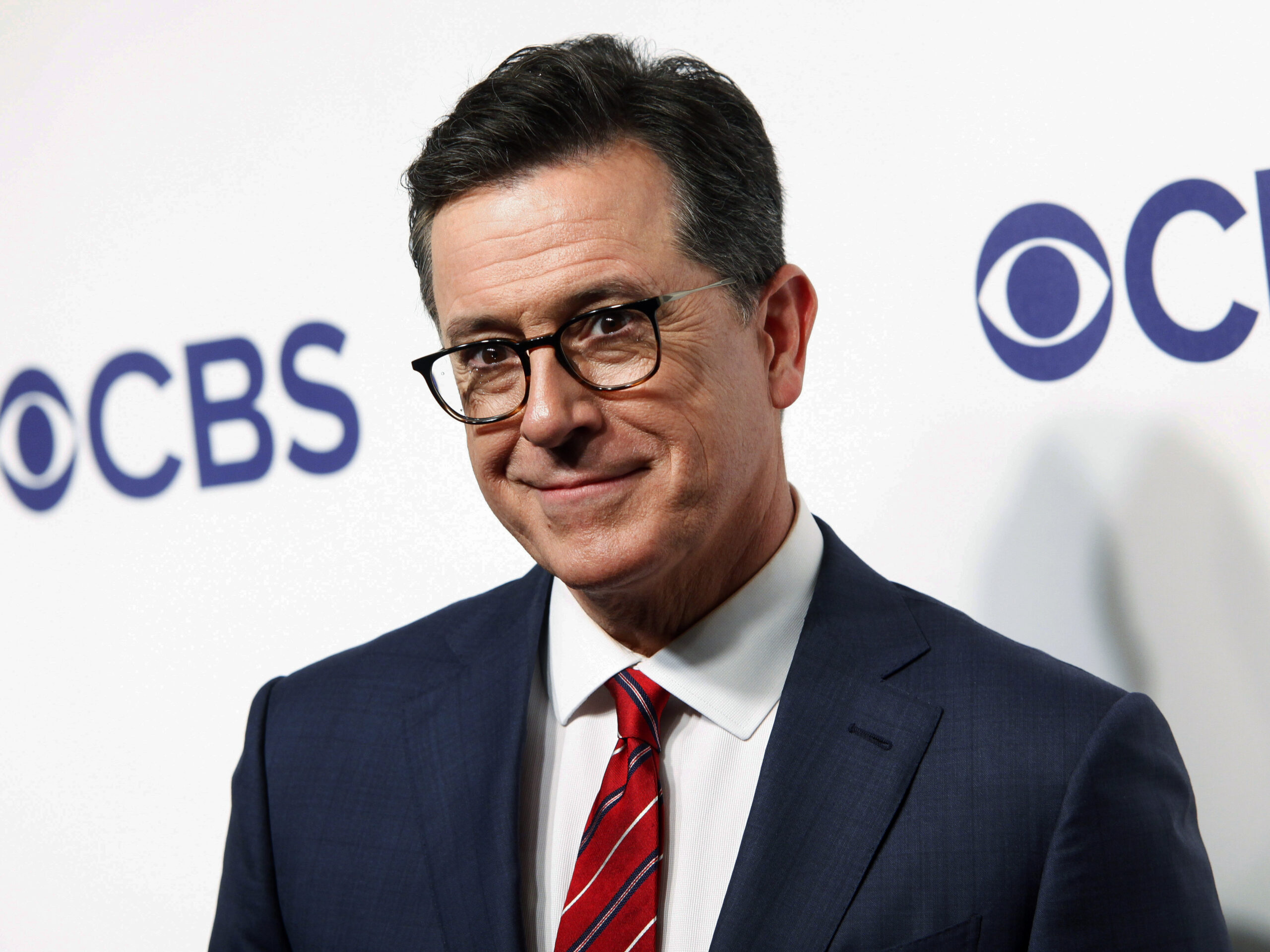 FILE - Stephen Colbert attends the CBS Network 2018 Upfront at The Plaza Hotel in New York on May 16, 2018. Colbert will return to doing live shows before a studio audience on June 14. CBS said Monday that audience members at the Ed Sullivan Theater in New York will be required to show proof of vaccination before being admitted, and face masks will be optional for them. (Photo by Andy Kropa/Invision/AP, File)