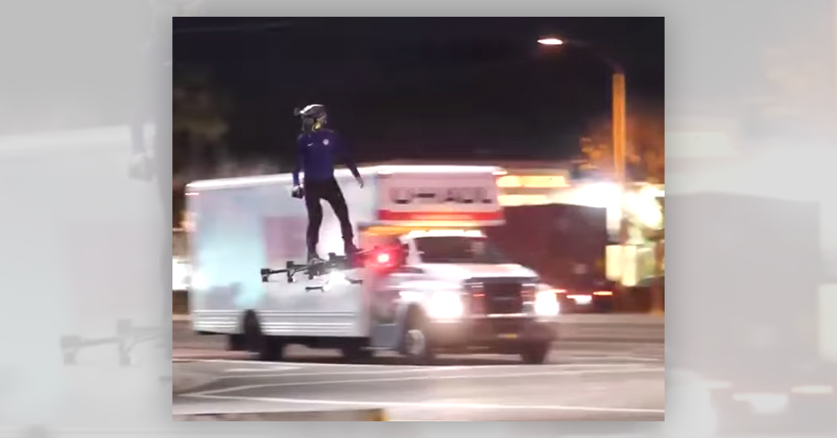 A video shows a man riding a drone-powered hoverboard through traffic.