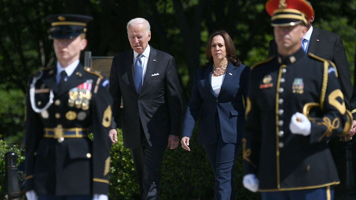 Kamala Harris and Joe Biden seen along with servicemembers of the U.S. military