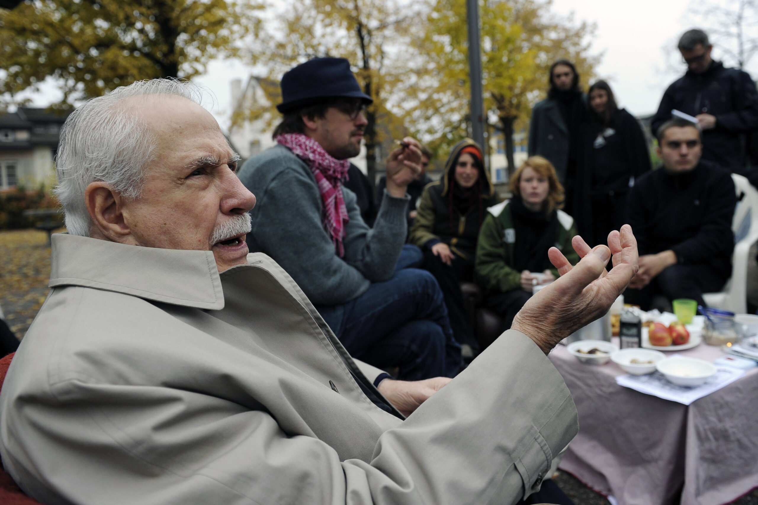 FILE - Former Democratic U.S. senator Mike Gravel gestures while talking to "Occupy" activists at Lindenhof square in Zurich, Switzerland, in this Monday, Oct. 31, 2011, file photo. Gravel, a former U.S. senator from Alaska who read the Pentagon Papers into the Congressional Record and confronted Barack Obama about nuclear weapons during a later presidential run, has died. He was 91. Gravel, who represented Alaska as a Democrat in the Senate from 1969 to 1981, died Saturday, June 26, 2021. Gravel had been living in Seaside, California, and was in failing health, said Theodore W. Johnson, a former aide. (AP Photo/Keystone, Steffen Schmidt, File)