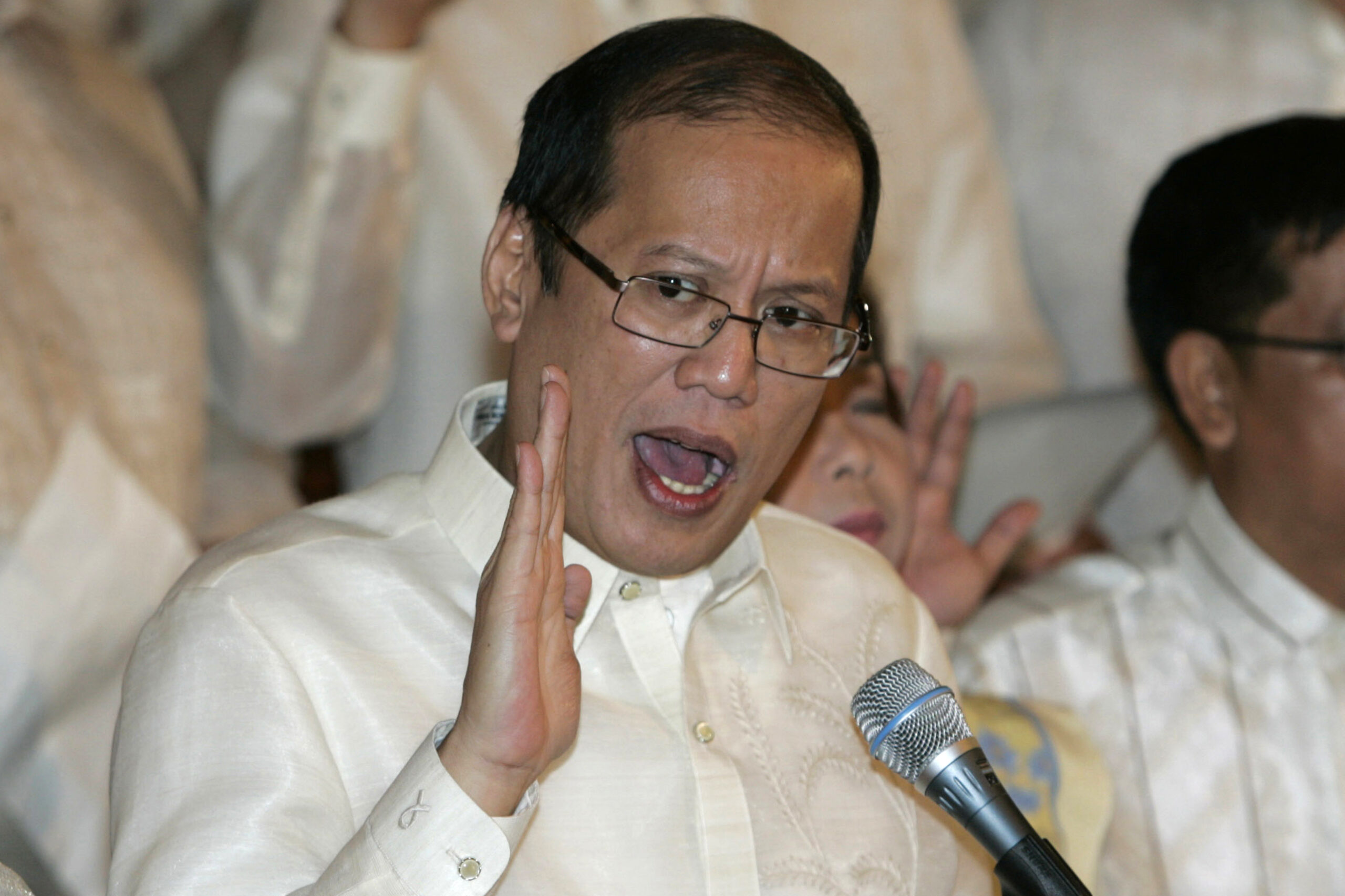 FILE - In this June 30, 2010, file photo, then newly inaugurated Philippine President Benigno Aquino III, center, swears in local officials during his first day at the Malacanang presidential palace in Manila, Philippines. Aquino, the son of pro-democracy icons who helped topple dictator Ferdinand Marcos and had troublesome ties with China, died Thursday, June 24, 2021, a cousin and public officials said. (AP Photo/Aaron Favila, File)