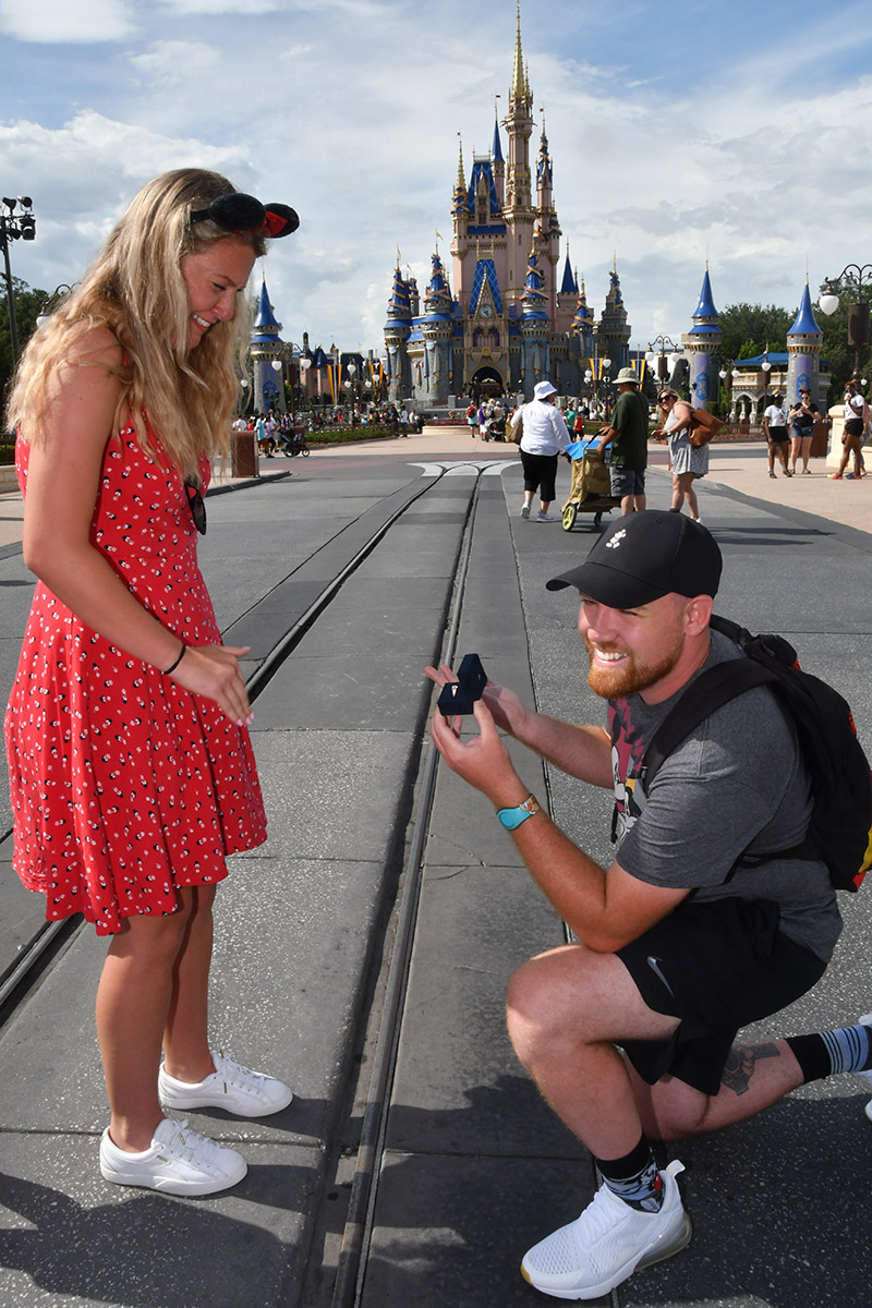 A couple got engaged at Walt Disney World Resort in front of Cinderella Castle at Magic Kingdom and they're on the hunt for people who appeared to be taking a video of the magical moment.
