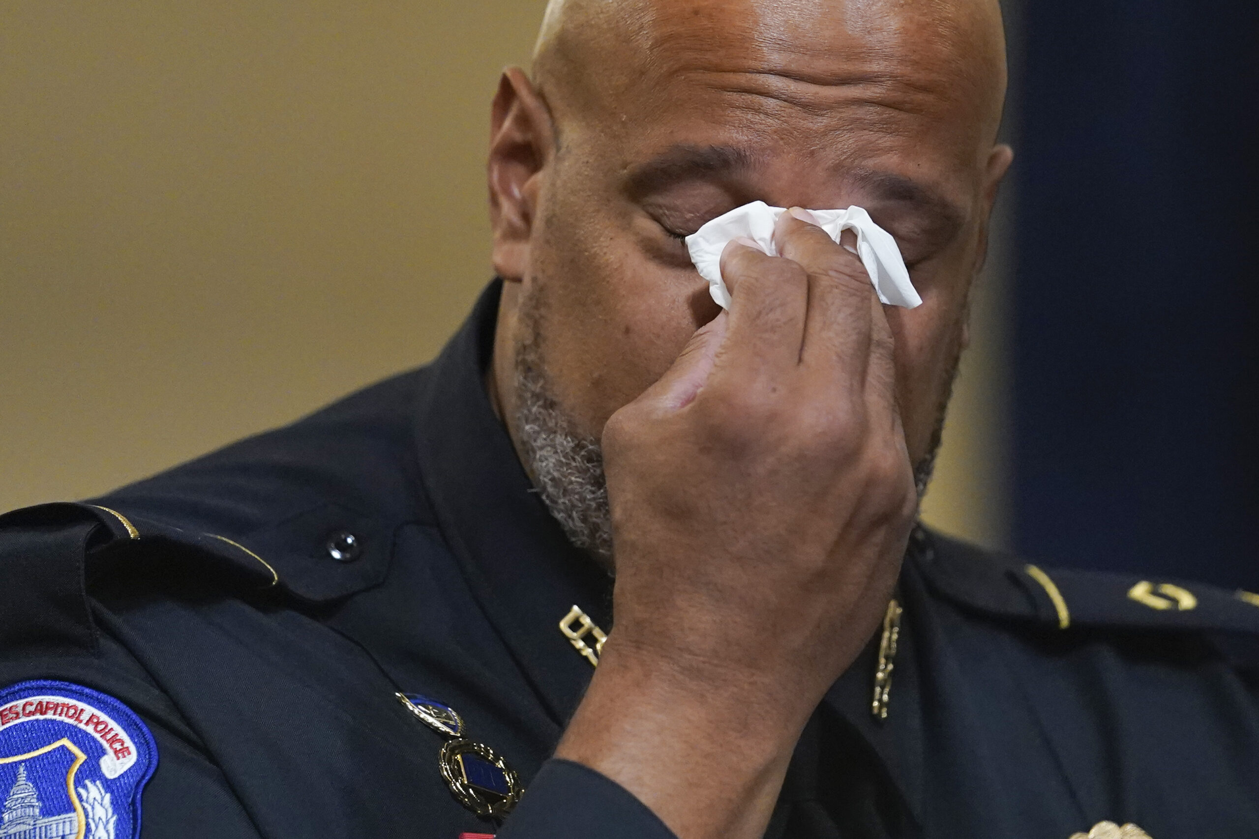 Washington Metropolitan Police Department officer Daniel Hodges wipes his eyes during the House select committee hearing on the Jan. 6 attack on Capitol Hill in Washington, Tuesday, July 27, 2021. (AP Photo/ Andrew Harnik, Pool)