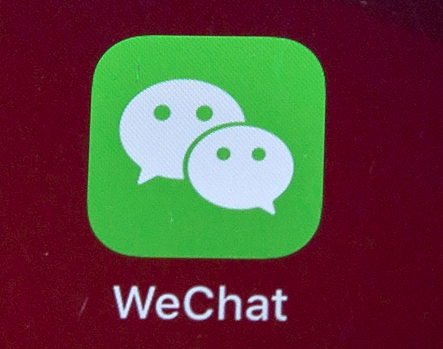 In this Aug. 7, 2020, file photo, icons for the smartphone app WeChat is seen on a smartphone screen in Beijing. China’s most popular social media service has deleted accounts on LGBT topics run by university students and nongovernment groups, prompting concern the ruling Communist Party is tightening control over gay and lesbian content. (AP Photo/Mark Schiefelbein, File)