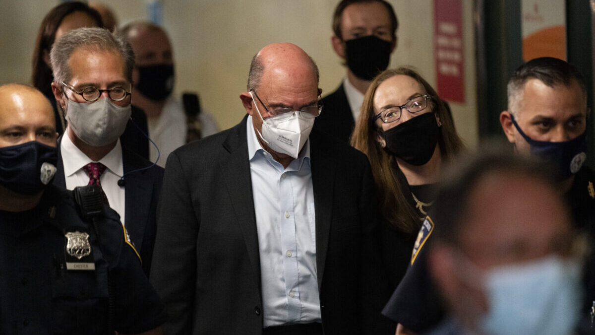 Allen Weisselberg, center, departs Manhattan criminal court, Thursday, July 1, 2021, in New York. Weisselberg was arraigned a day after a grand jury returned an indictment charging him and Trump’s company with tax crimes. Trump himself was not charged. (AP Photo/John Minchillo)