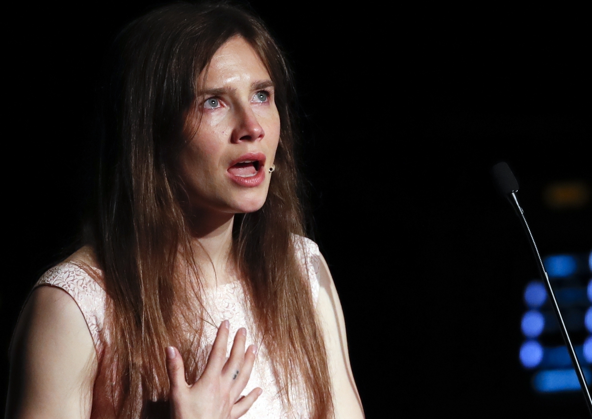 FILE - In this June 15, 2019 file photo, Amanda Knox gets emotional as she speaks at a Criminal Justice Festival at the University of Modena, Italy. Knox is speaking out about her name being associated with the new film “Stillwater,” Friday, July 30, 2021, saying any connection rips off “my story without my consent at the expense of my reputation.” “Stillwater” stars Matt Damon as a father who flies to France to help his estranged daughter, who has been convicted of murdering her girlfriend. (AP Photo/Antonio Calanni, File)