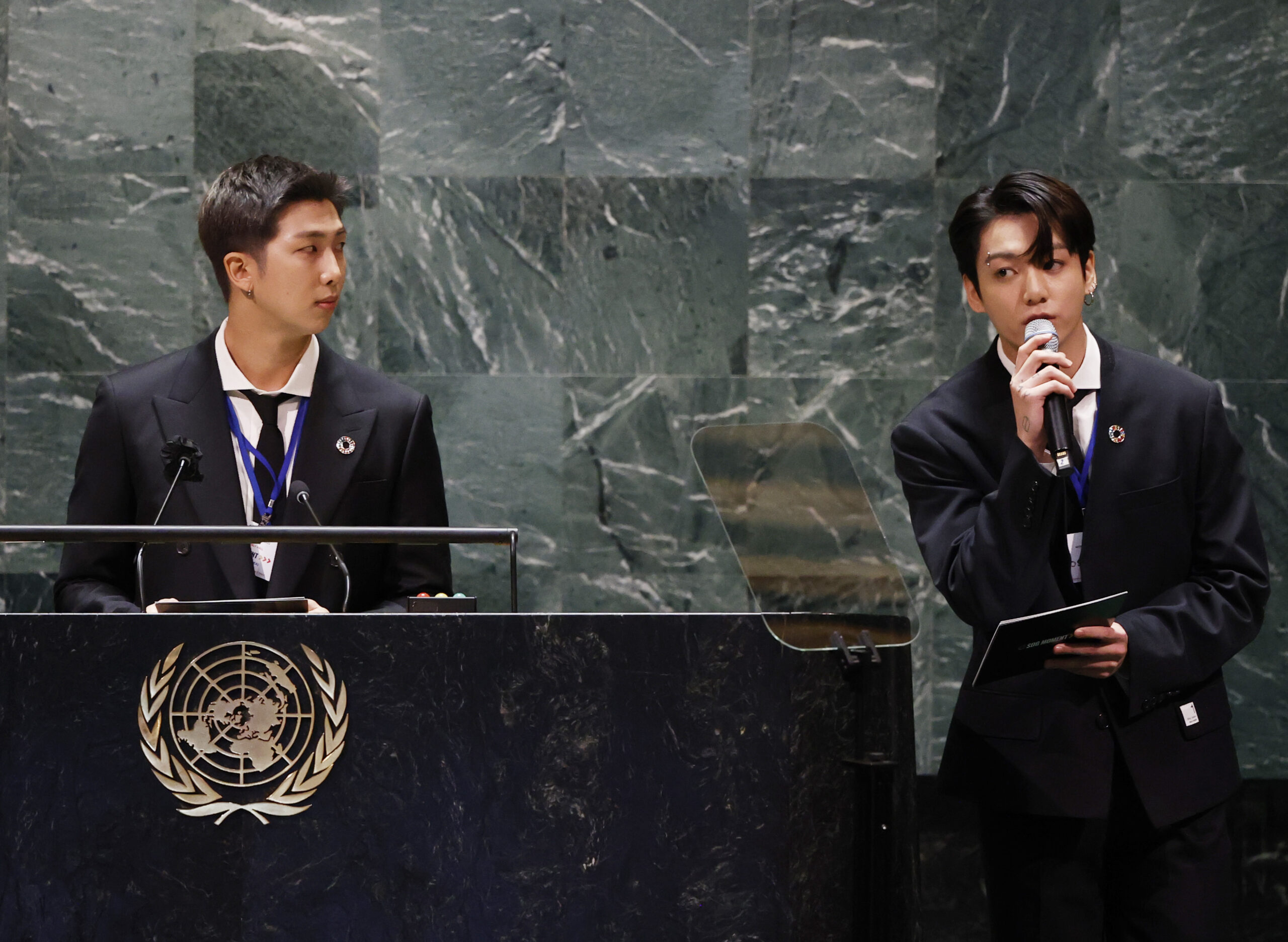 ADDS IDS - Members of South Korean K-pop band BTS, RM, left, and Jung Kook appear at the Sustainable Development Goals meeting during the 76th session of the United Nations General Assembly, at the United Nations Headquarters on Monday, Sept. 20, 2021. (John Angelillo/Pool via AP)