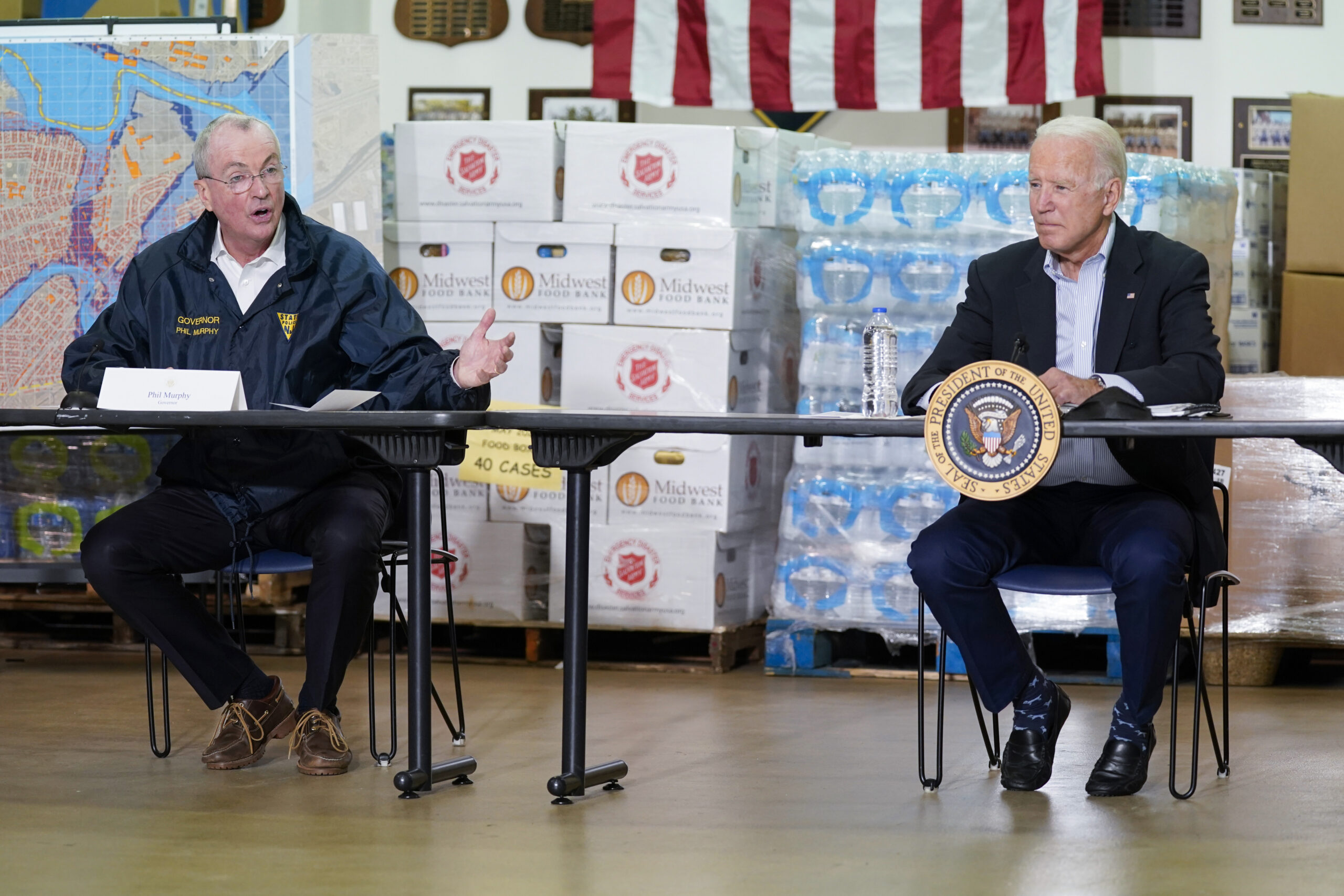 President Joe Biden listens as New Jersey Gov. Phil Murphy, left, speaks during a briefing about the impact of Hurricane Ida, Tuesday, Sept. 7, 2021, in Hillsborough Township, N.J. (AP Photo/Evan Vucci)