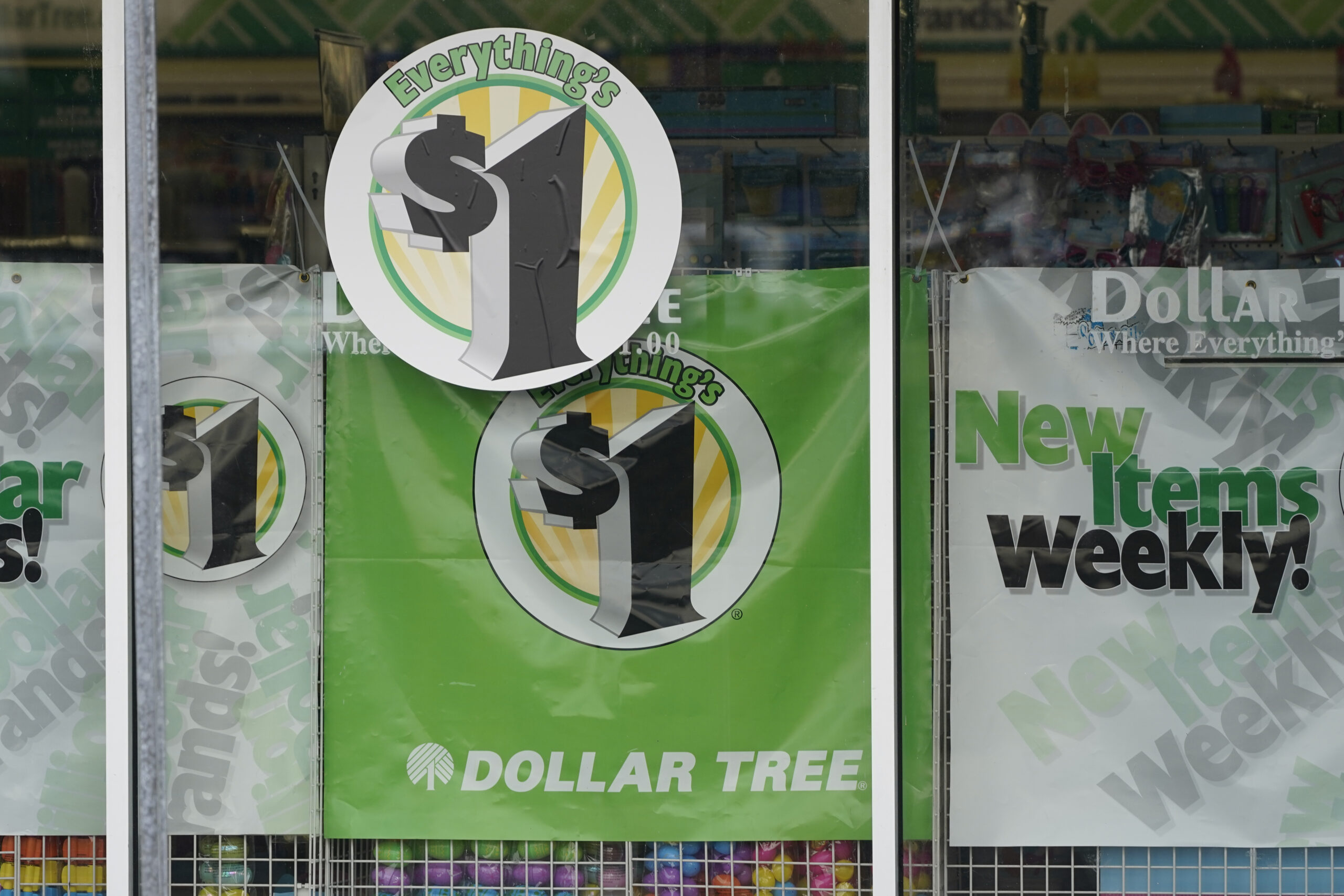 In this Feb. 25, 2021 photo, Dollar Tree store logos indicating that everything in the store is for $1 are promoted on its storefront window in Jackson, Miss. Dollar Tree, the national chain of stores that promises everything from a buck, will begin introducing items on its shelves that will exceed $1. The company said, Wednesday, Sept. 29, that it's responding to customer requests and said pushing the $1 barrier will allow for a better mix of products. (AP Photo/Rogelio V. Solis)