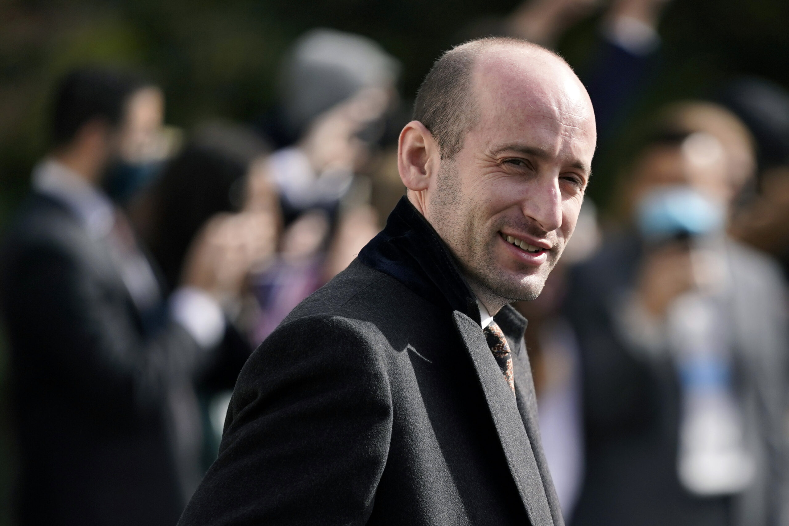 FILE - In this Oct. 30, 2020, file photo, then-President Donald Trump's White House senior adviser Stephen Miller walks on the South Lawn of the White House in Washington. Tens of thousands of Afghan refugees fleeing the Taliban are arriving in the U.S., and a handful of former Trump administration officials are working to turn Republicans against them. (AP Photo/Patrick Semansky, File)