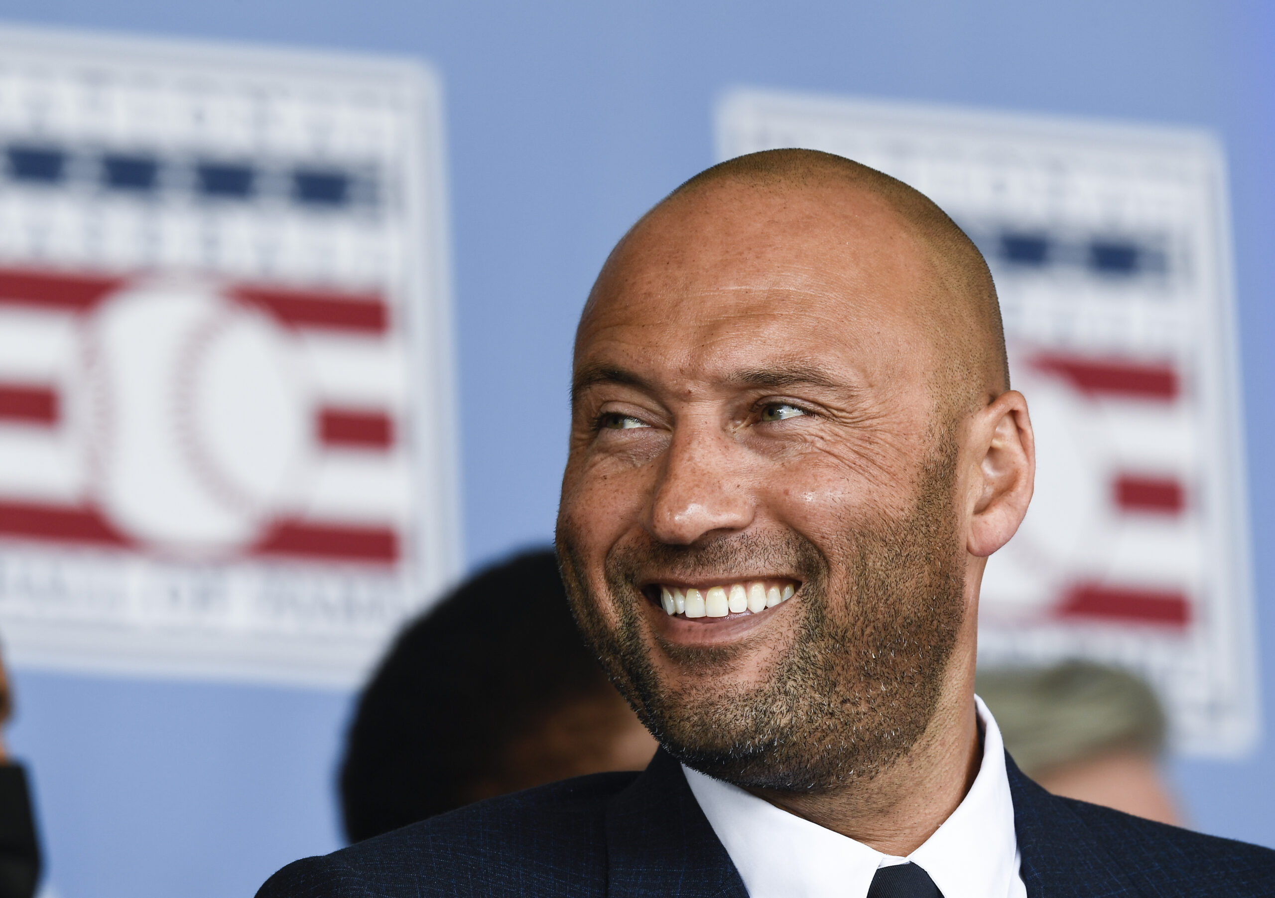 Hall of Fame inductee Derek Jeter, of the New York Yankees, watches a video during an induction ceremony at the Clark Sports Center at the National Baseball Hall of Fame, Wednesday, Sept. 8, 2021, in Cooperstown, N.Y. (AP Photo/Hans Pennink)