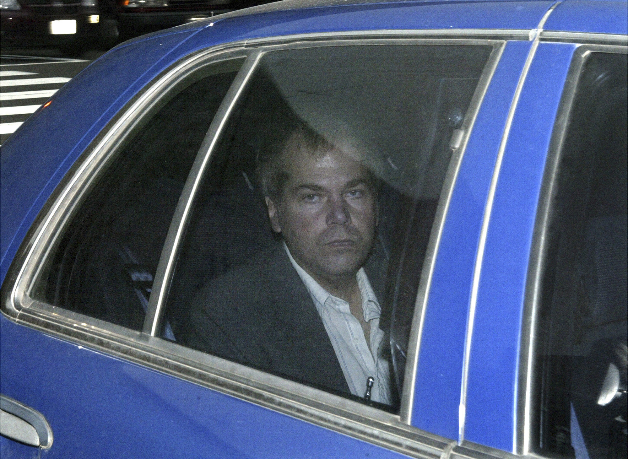 FILE - In this Nov. 18, 2003, file photo, John Hinckley Jr. arrives at U.S. District Court in Washington. Lawyers for Hinckley, the man who tried to assassinate President Ronald Reagan, are scheduled to argue in court Monday, Sept. 27, 2021, that the 66-year-old should be freed from restrictions placed on him after he moved out of a Washington hospital in 2016. (AP Photo/Evan Vucci, File)