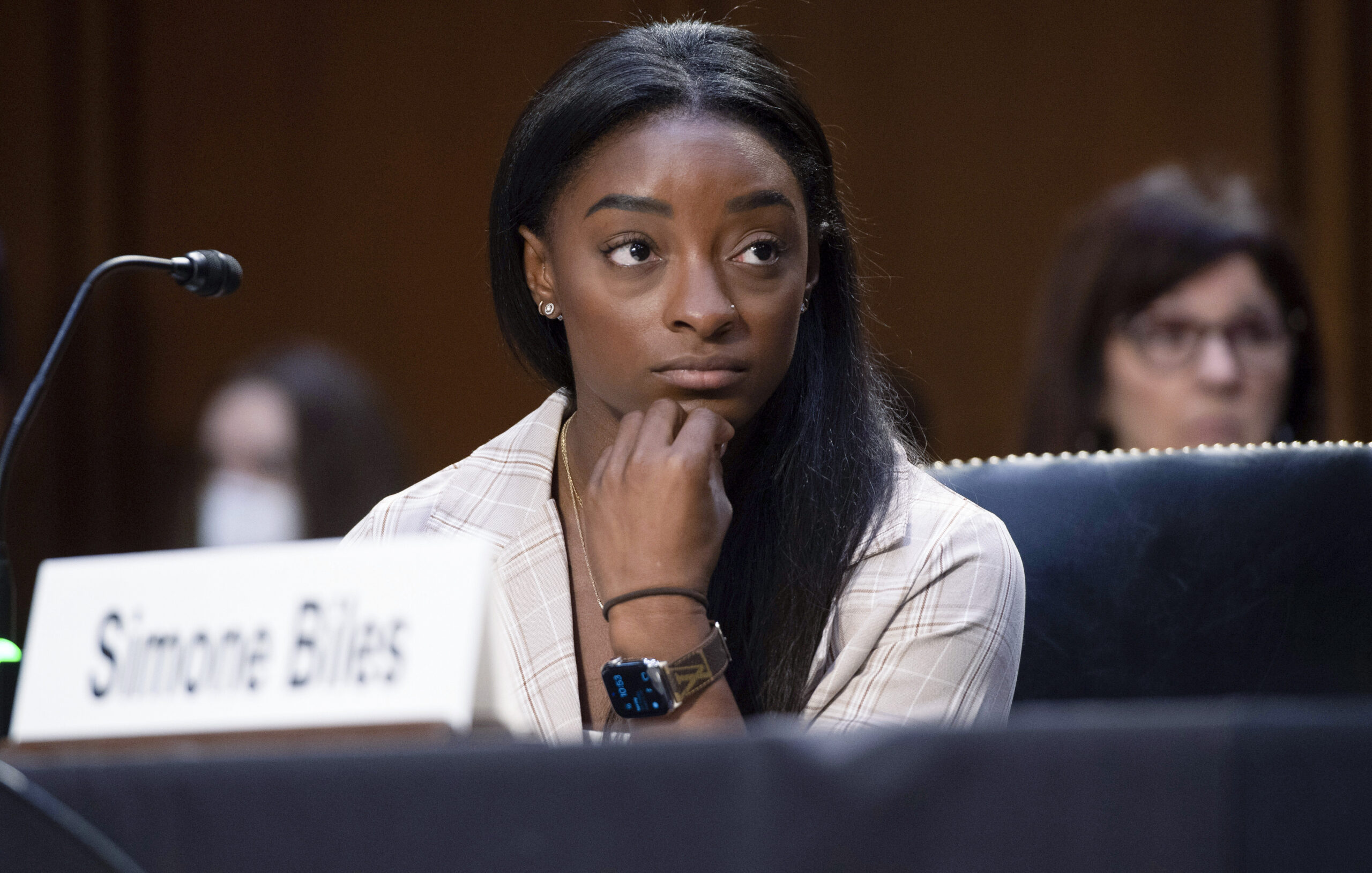 United States Olympic gymnast Simone Biles testifies during a Senate Judiciary hearing about the Inspector General's report on the FBI's handling of the Larry Nassar investigation on Capitol Hill, Wednesday, Sept. 15, 2021, in Washington. Nassar was charged in 2016 with federal child pornography offenses and sexual abuse charges in Michigan. He is now serving decades in prison after hundreds of girls and women said he sexually abused them under the guise of medical treatment when he worked for Michigan State and Indiana-based USA Gymnastics, which trains Olympians. (Saul Loeb/Pool via AP)
